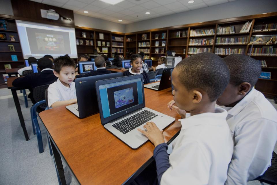 Students working on computers in a library