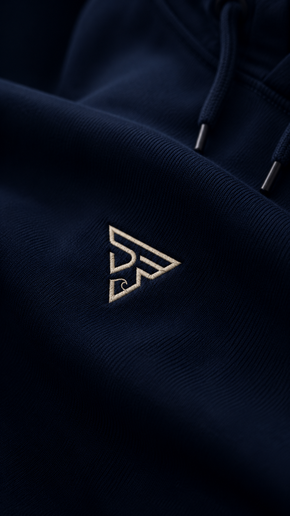 Stirux hoodie fabric drape with embroidered logo close-up
