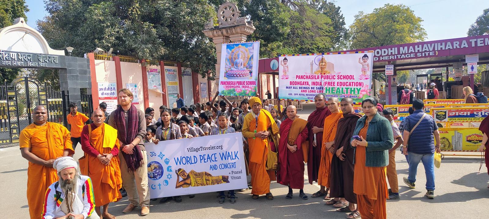 World Peace Walk at the Mahabodhi Temple gate in Bodhgaya with monks carrying banners