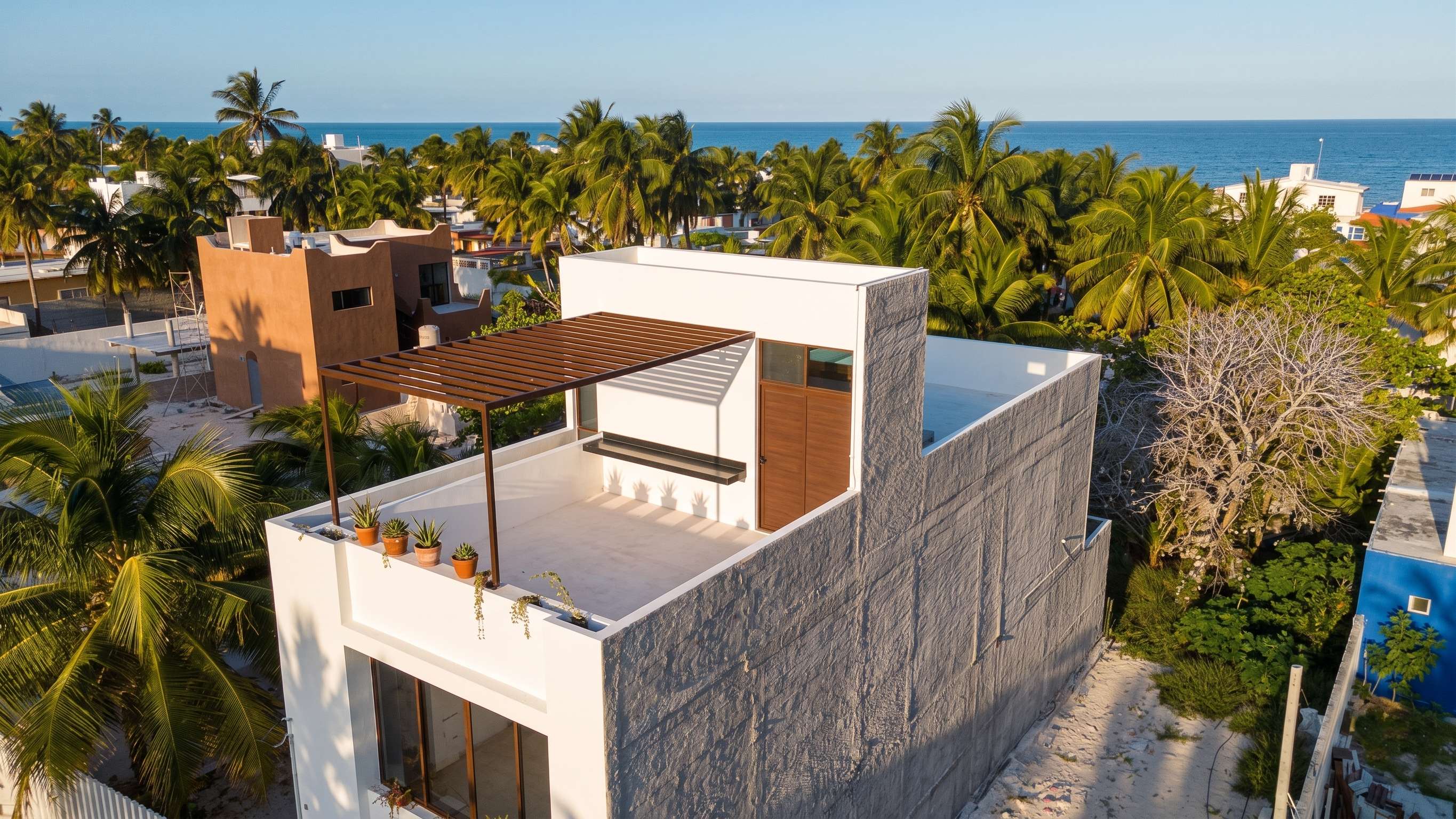 Vista aérea de Villas Nalú mostrando su cercanía al mar en Chuburná Puerto