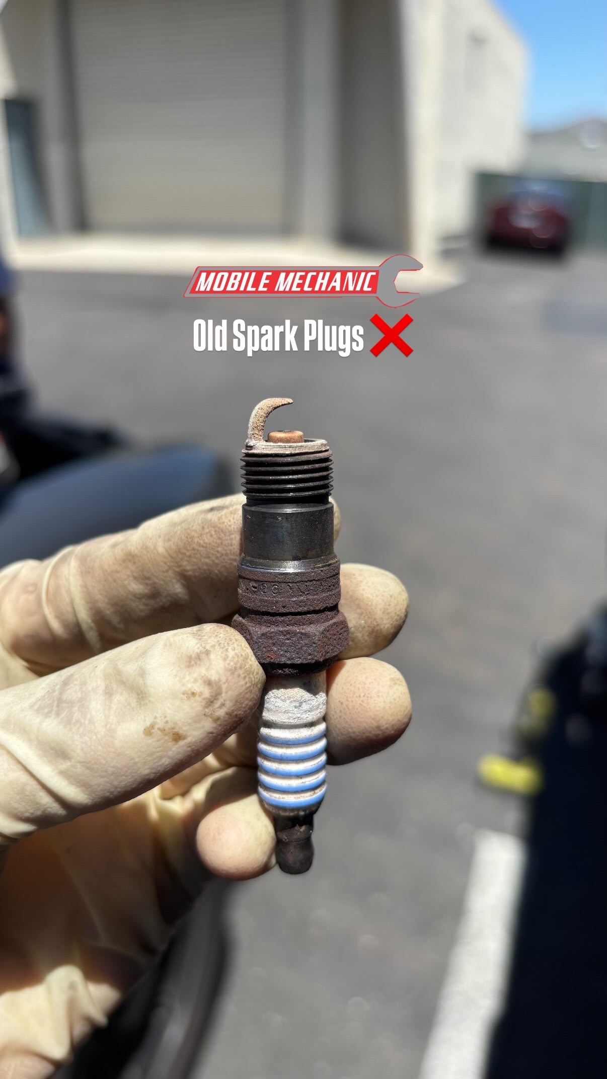 Old worn spark plug before replacement