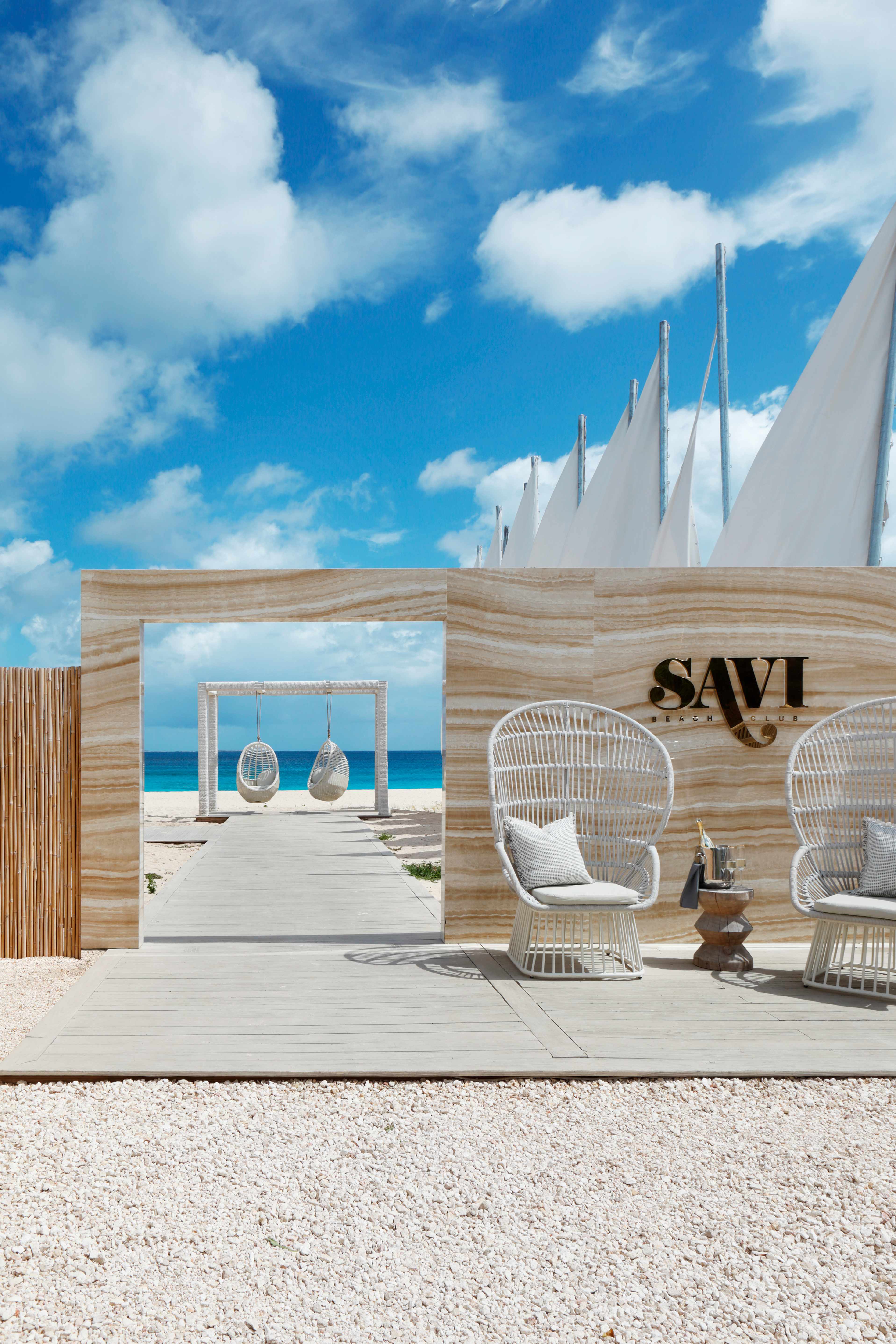 Modern beach club entrance with ocean view