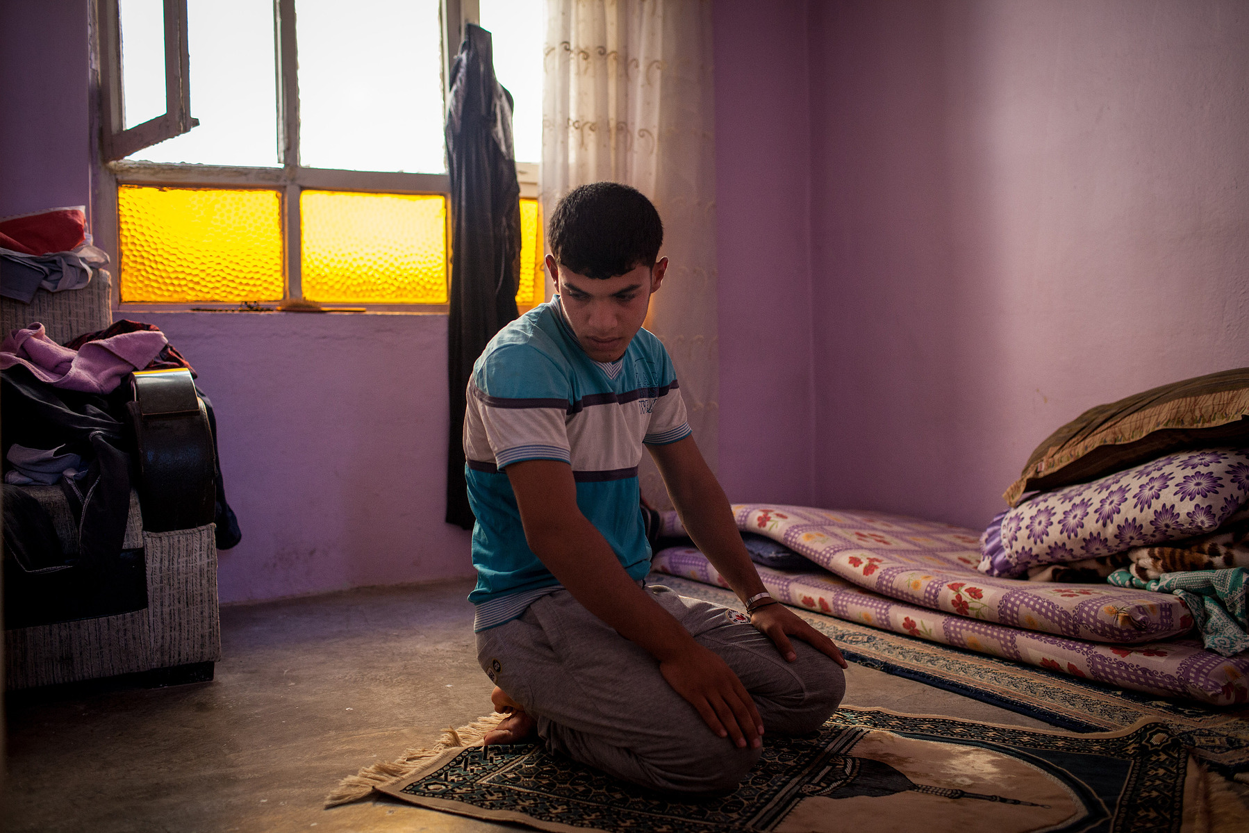 Abdülkadir al-Ali, a 16-year-old fighter, photographed by Bradley Secker during a quiet moment in Sanliurfa, Turkey