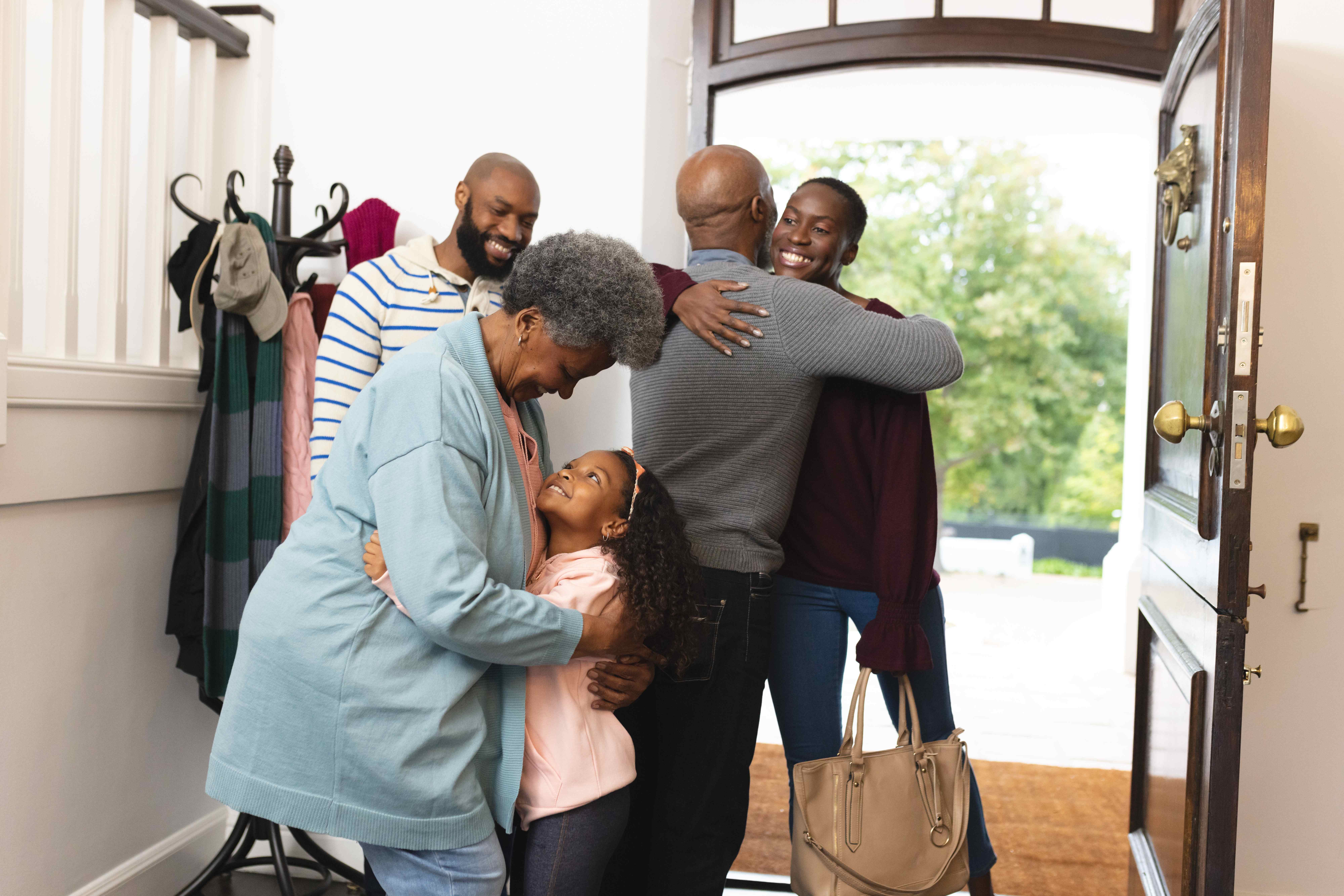 Multi-generational family sharing a loving embrace