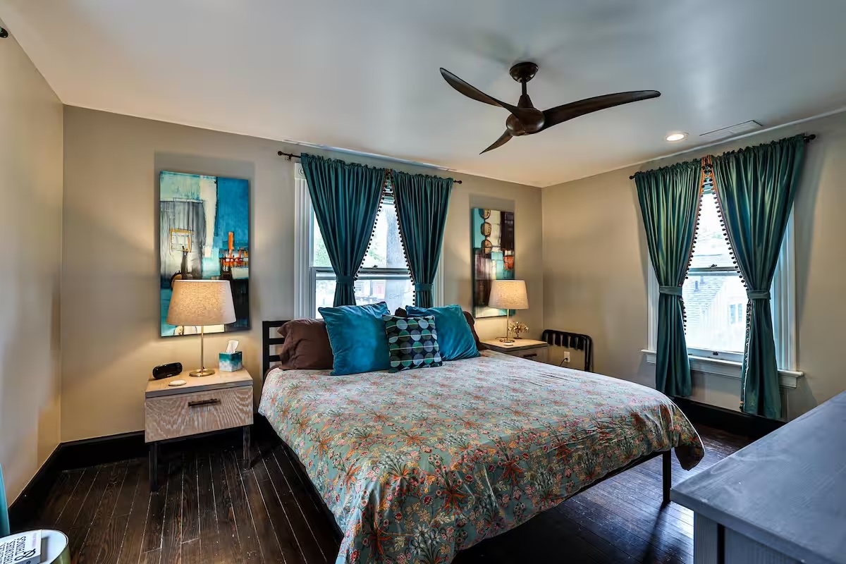 Queen bedroom with garden-facing windows