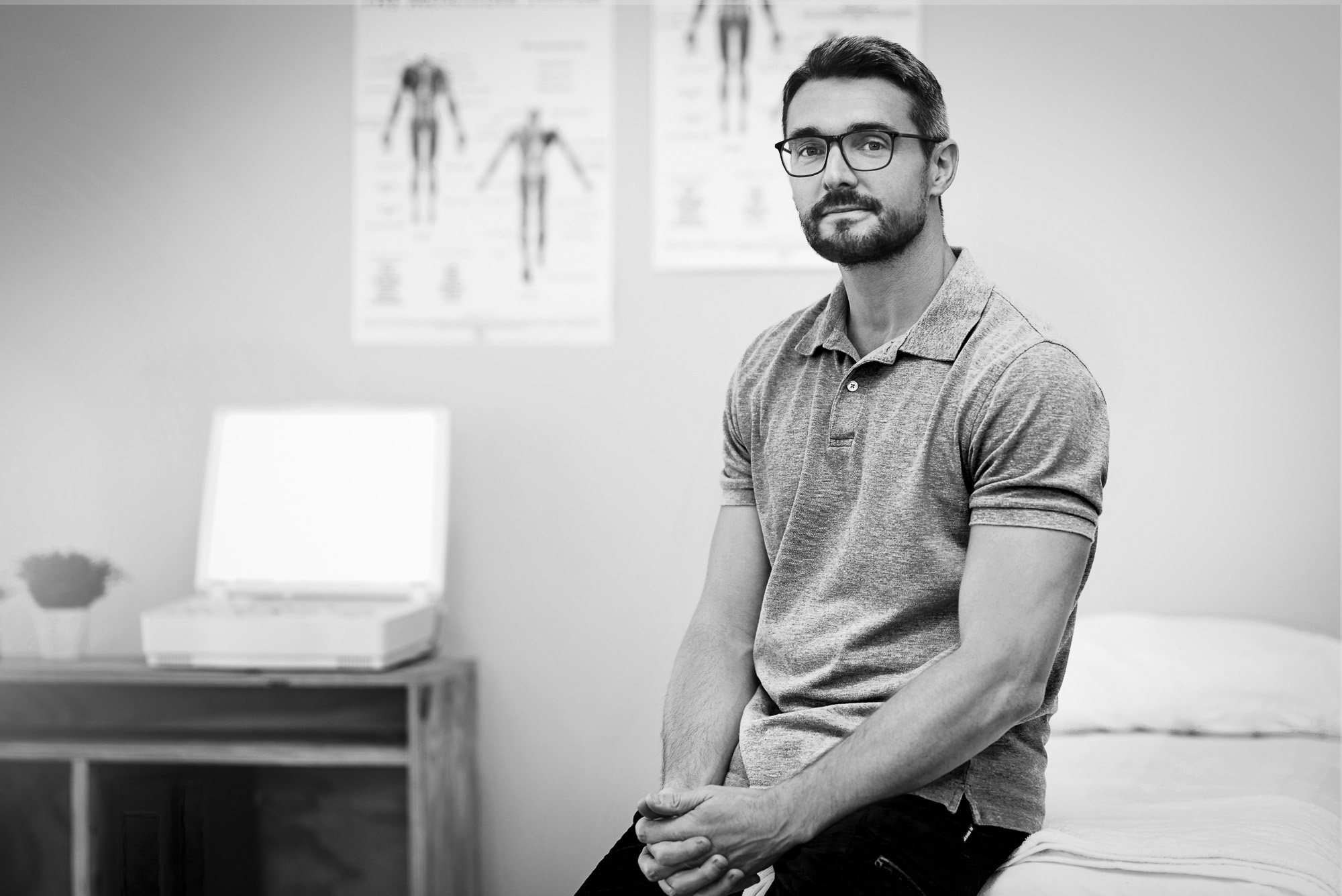 Professional man contemplating business premises decision in office environment