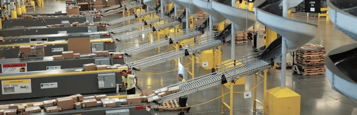 Amazon fulfillment center with conveyor belts and workers