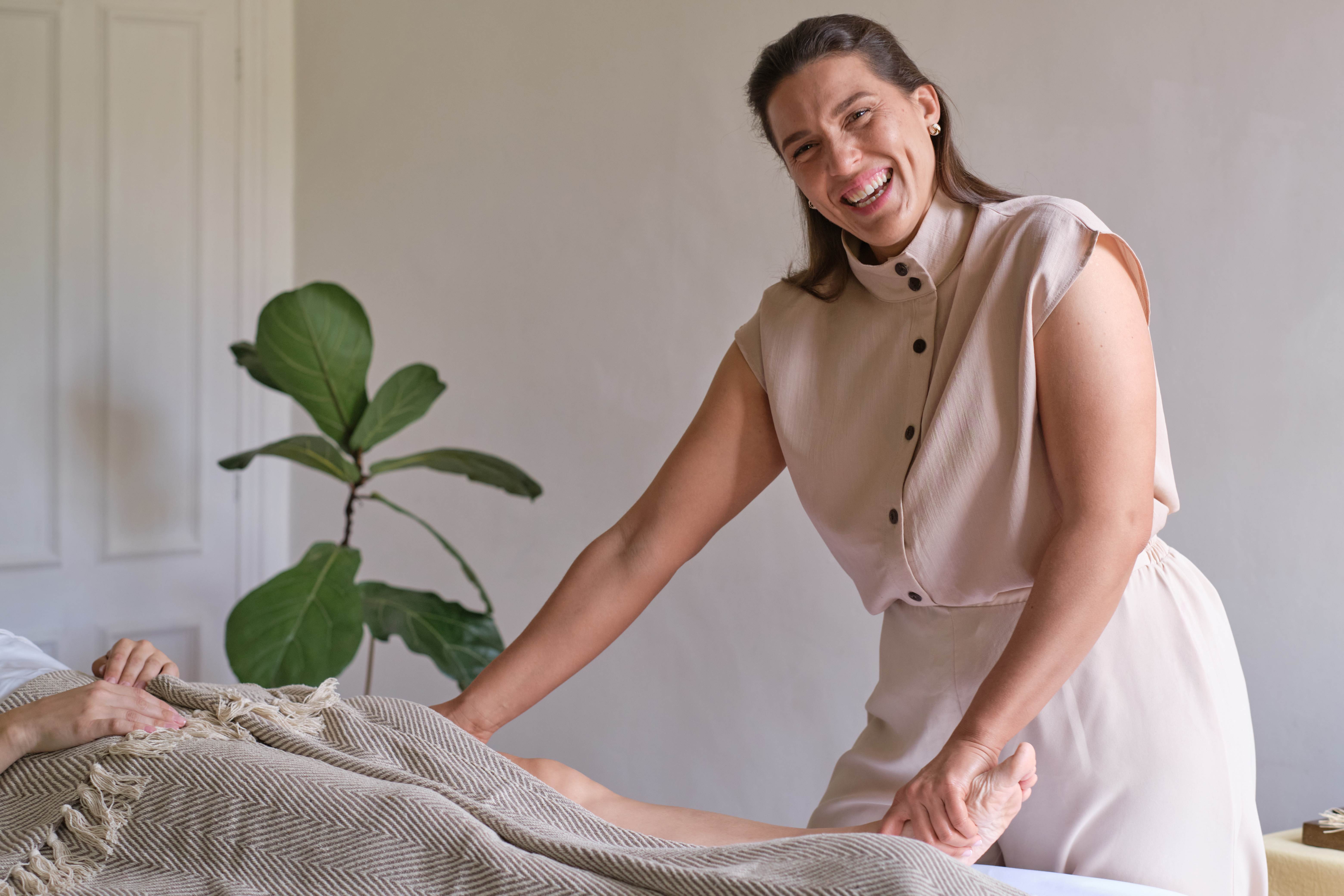 Erica performing professional massage therapy at home visit in West London