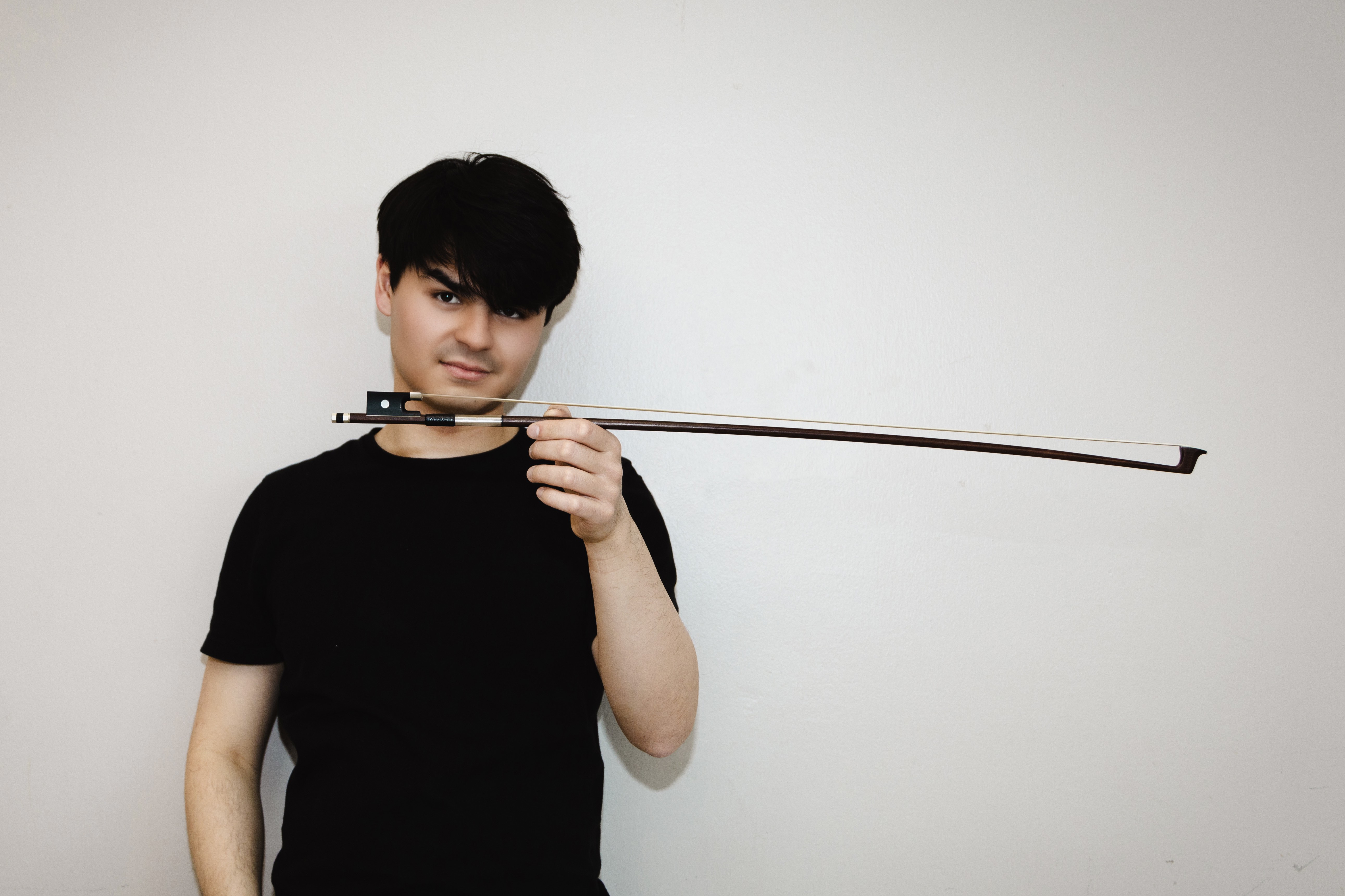 Avery Scott holding bow horizontally