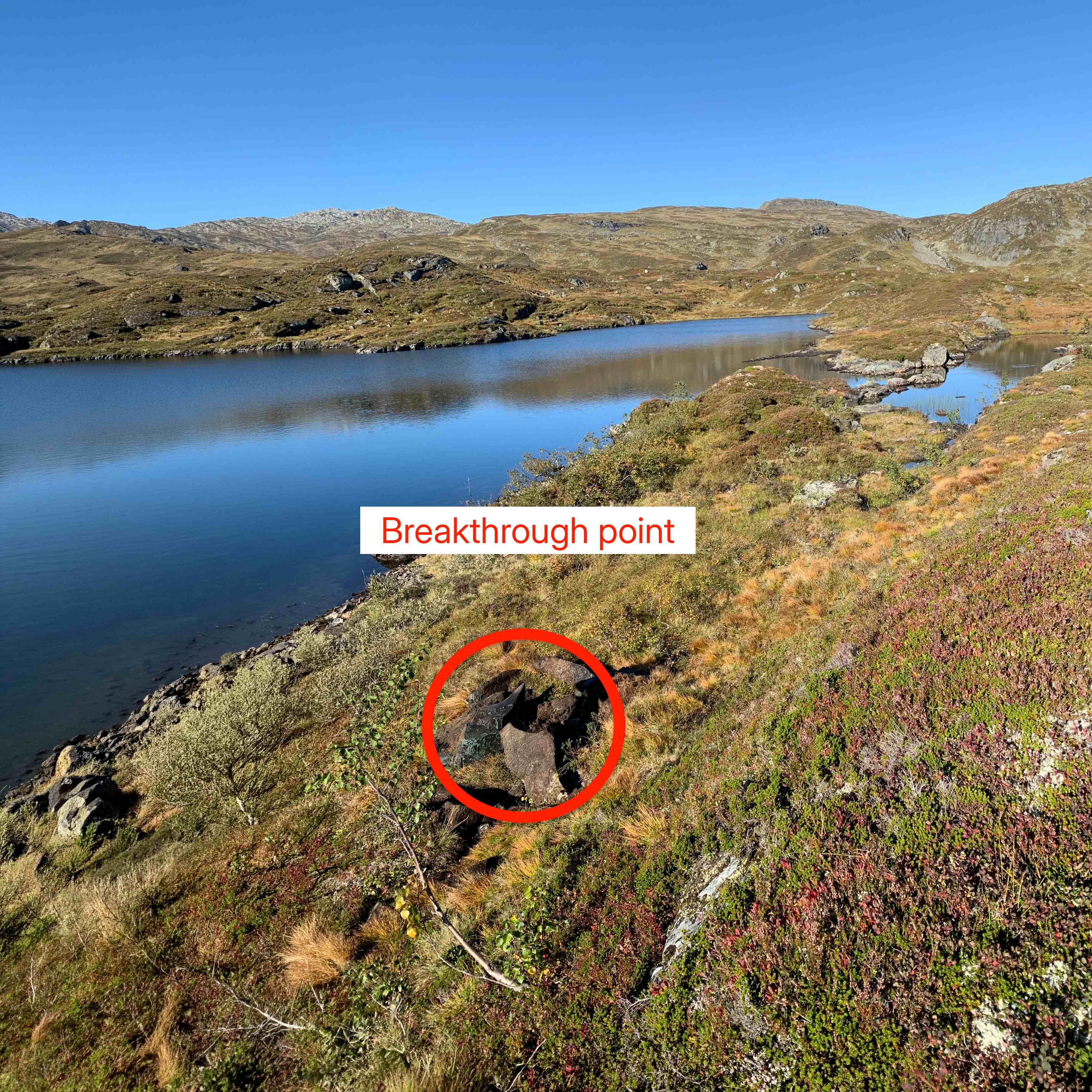 Norhard breakthrough point showing minimal surface impact in natural landscape