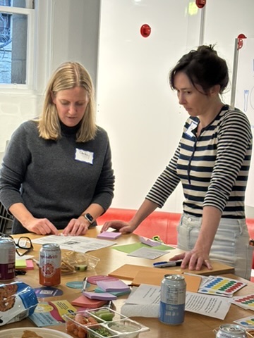 Peggy at microphone presenting INGREDIENTS course with colorful sticky notes