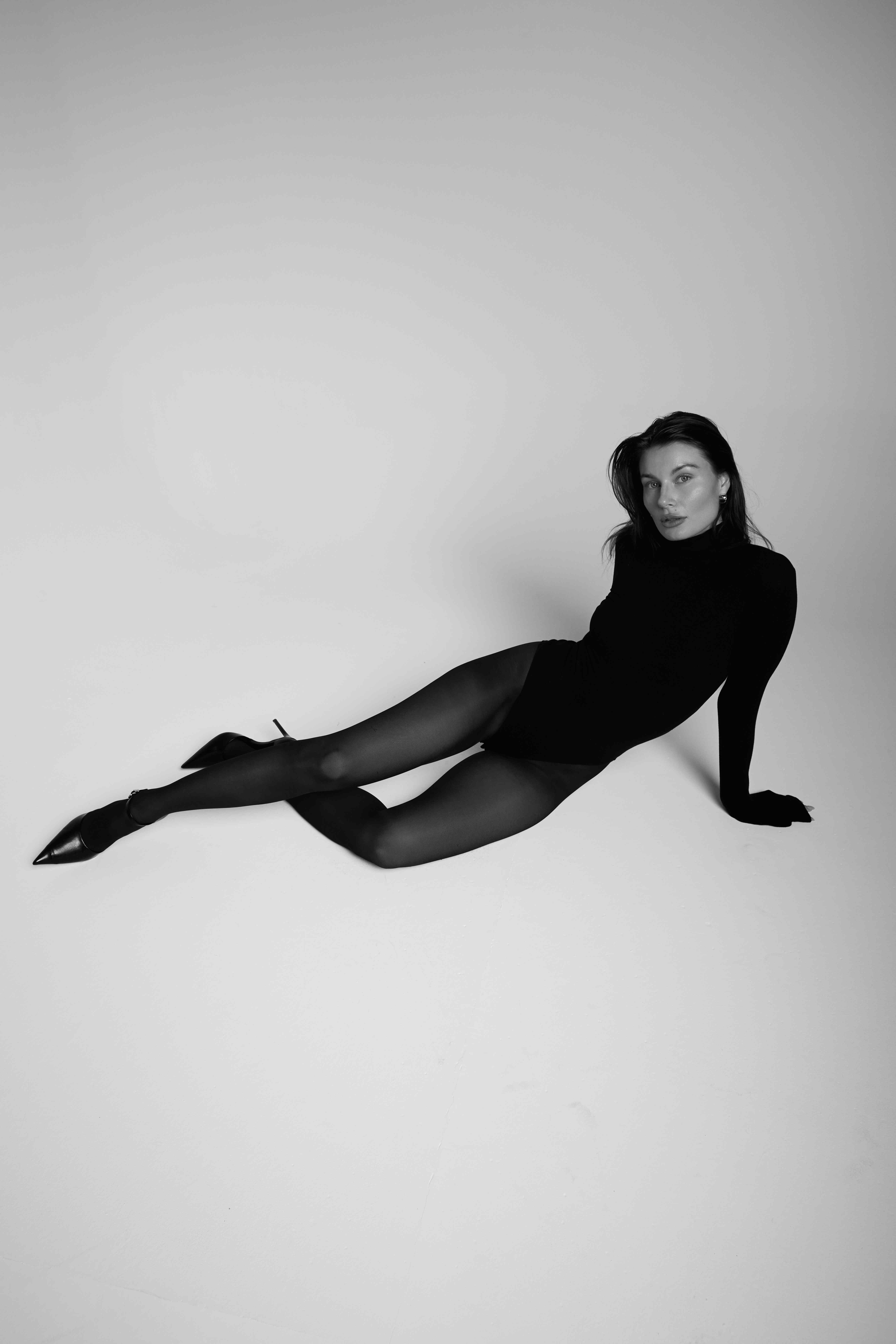 Black and white fashion portrait reclining pose