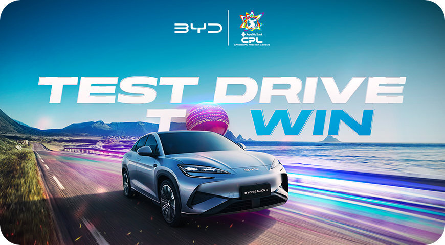 A BYD electric vehicle driving along a coastal road