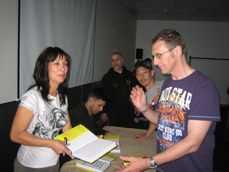Diana Lee Inosanto backstage signing books