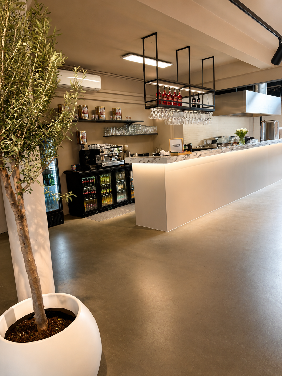 Bar area with counter and wine glass display