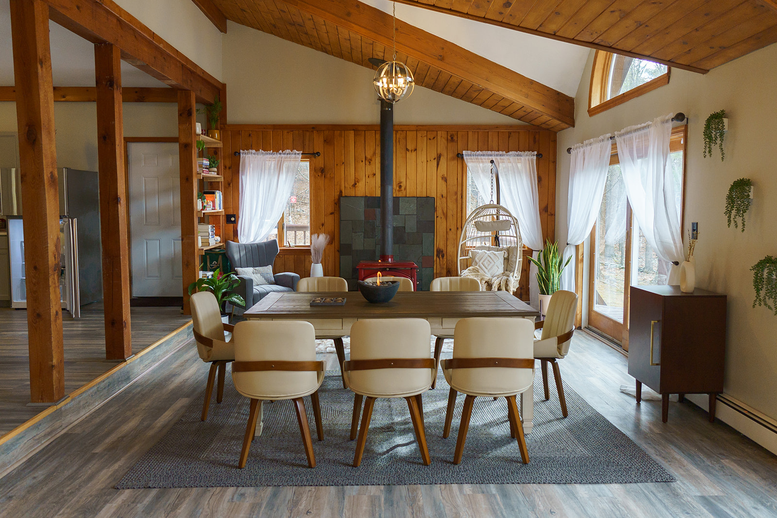 Open living space with high ceilings and wood stove
