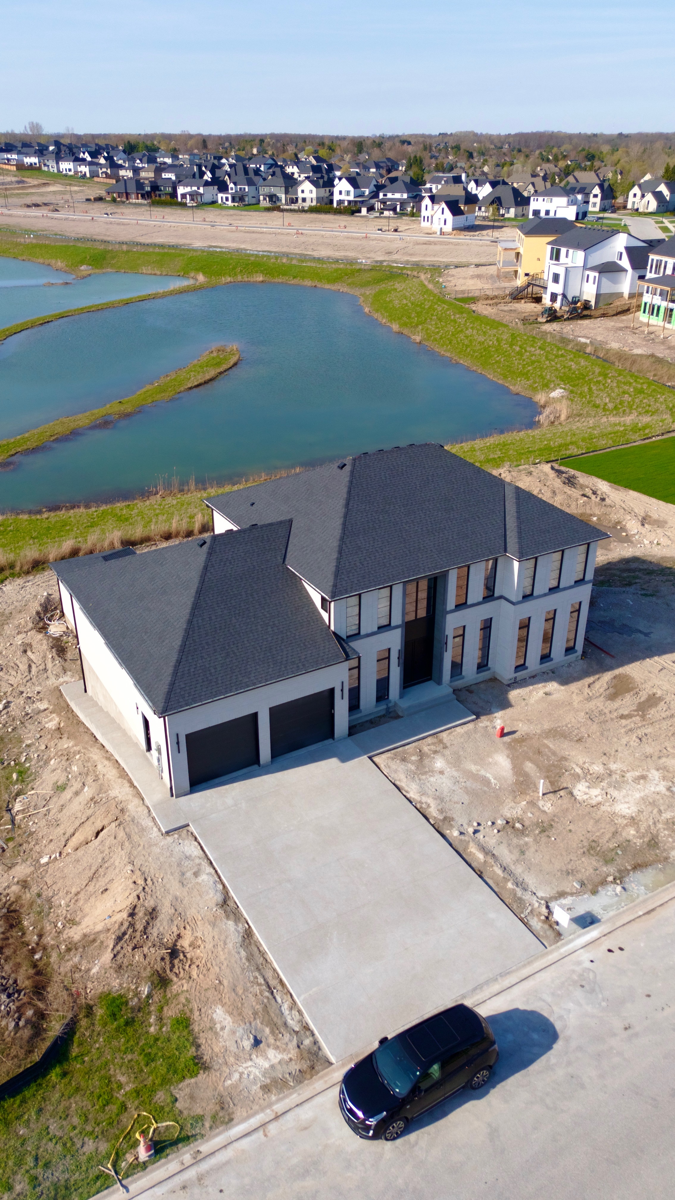 Aerial view of completed concrete driveway and home — Limestone Concrete Ltd