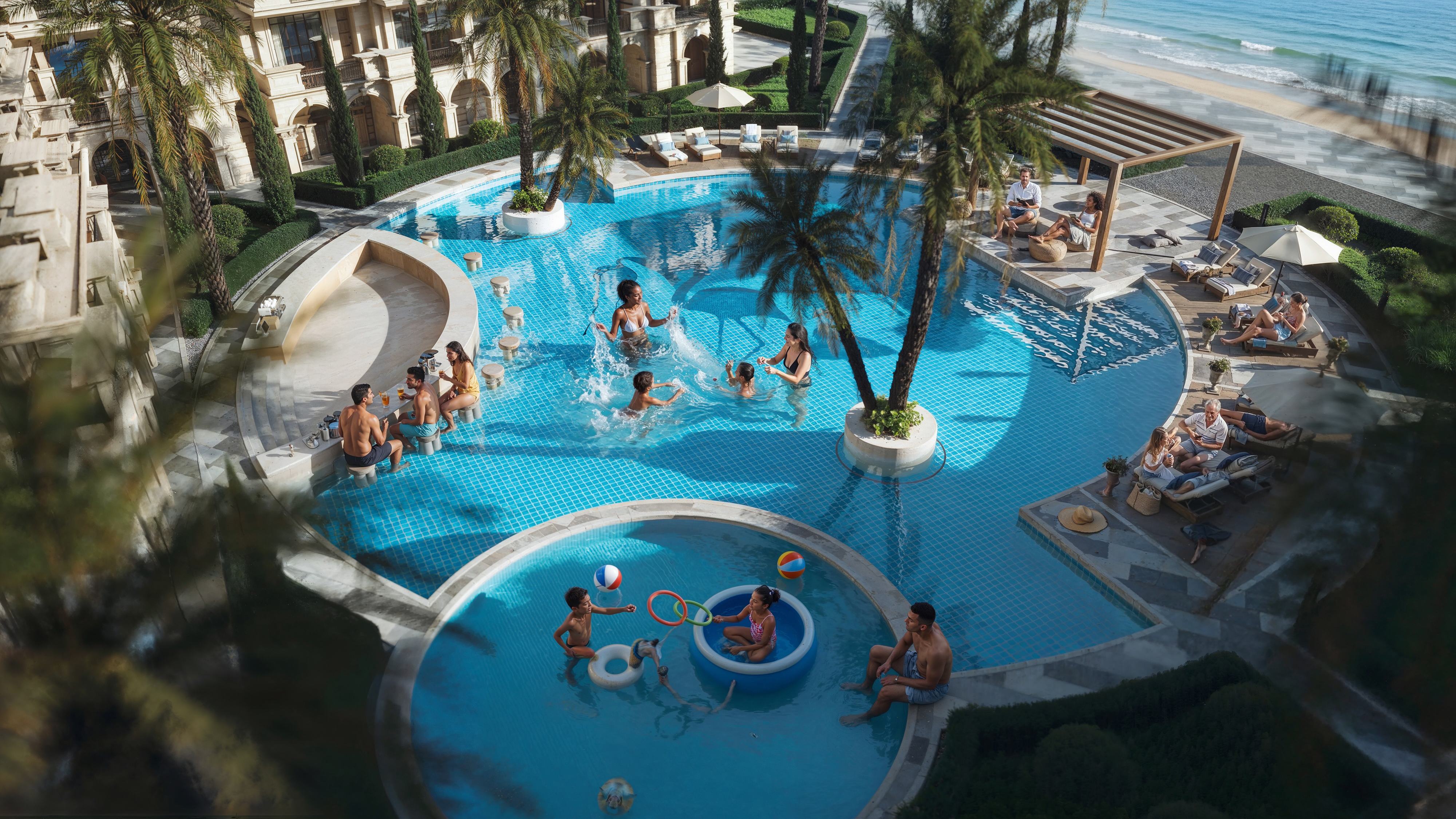 Family day at Aurora Palace pool with children playing