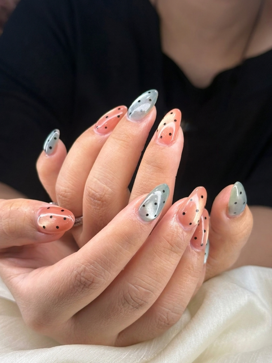 Gel manicure with peach coral and silver polka dot nail art at Colour Workshop Singapore