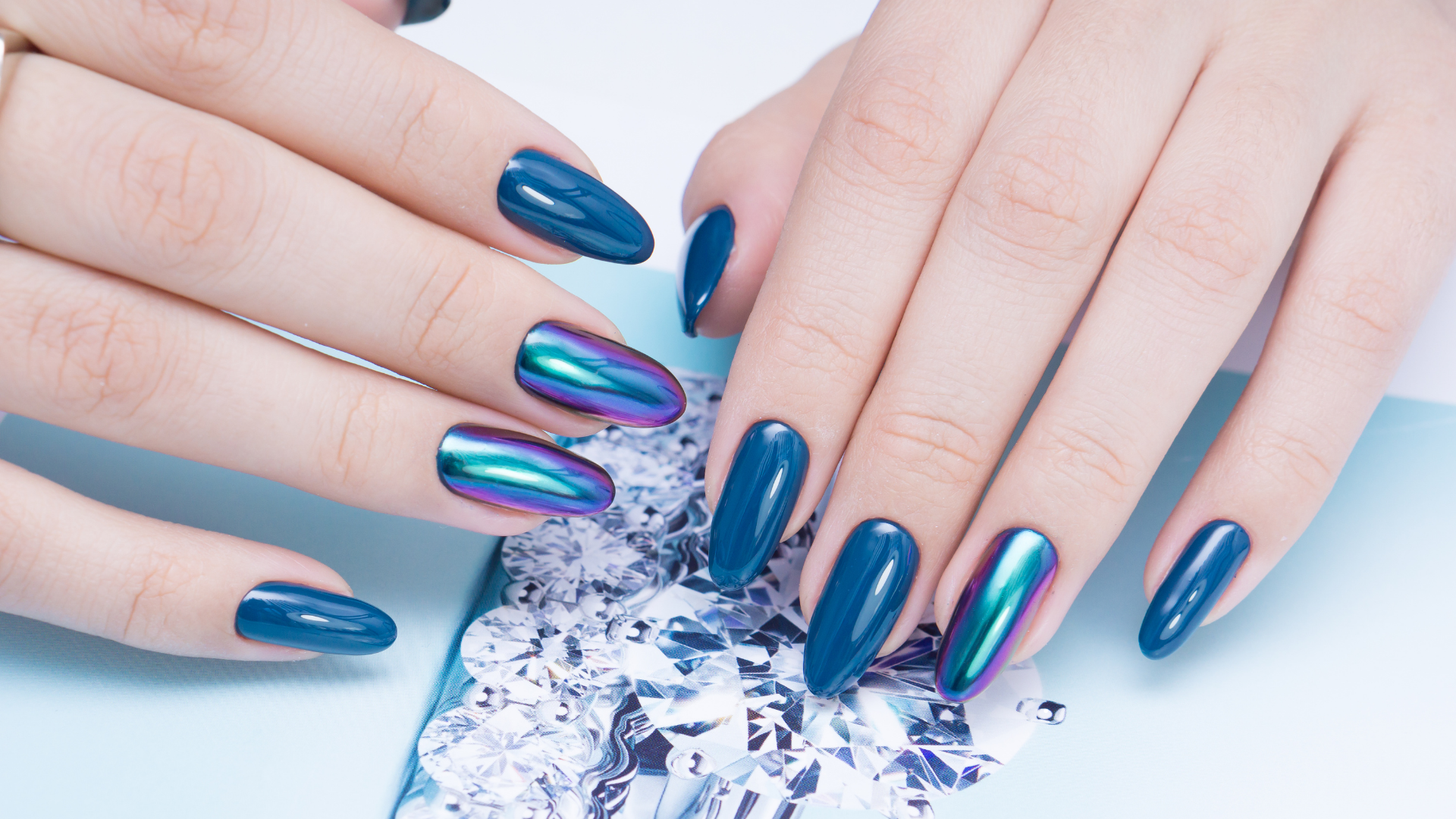 Dark teal chrome nails with iridescent accents by Colour Workshop Singapore