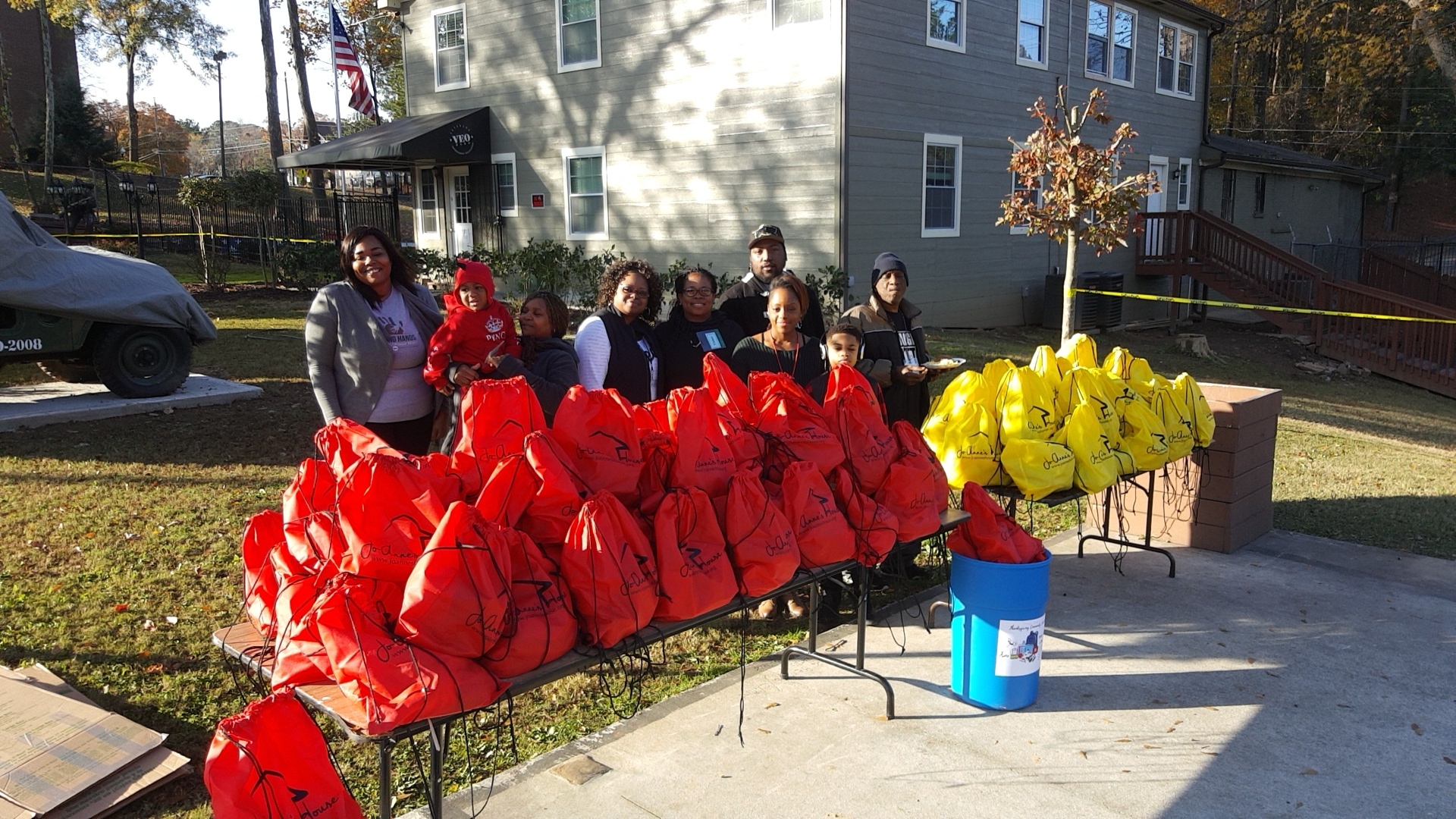 Volunteer team with donation bags at community event