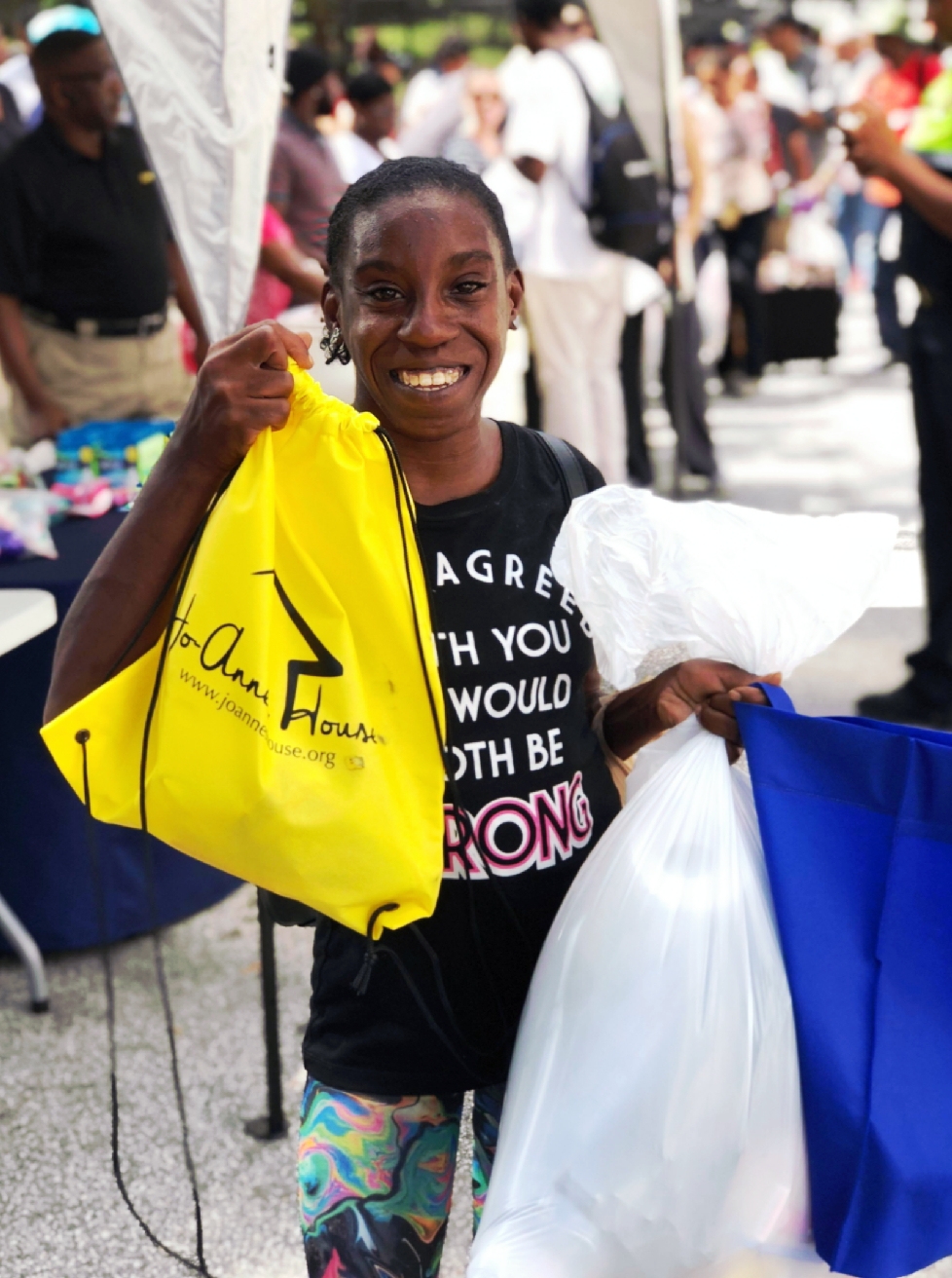 Happy recipient with Jo-Anne's House bag