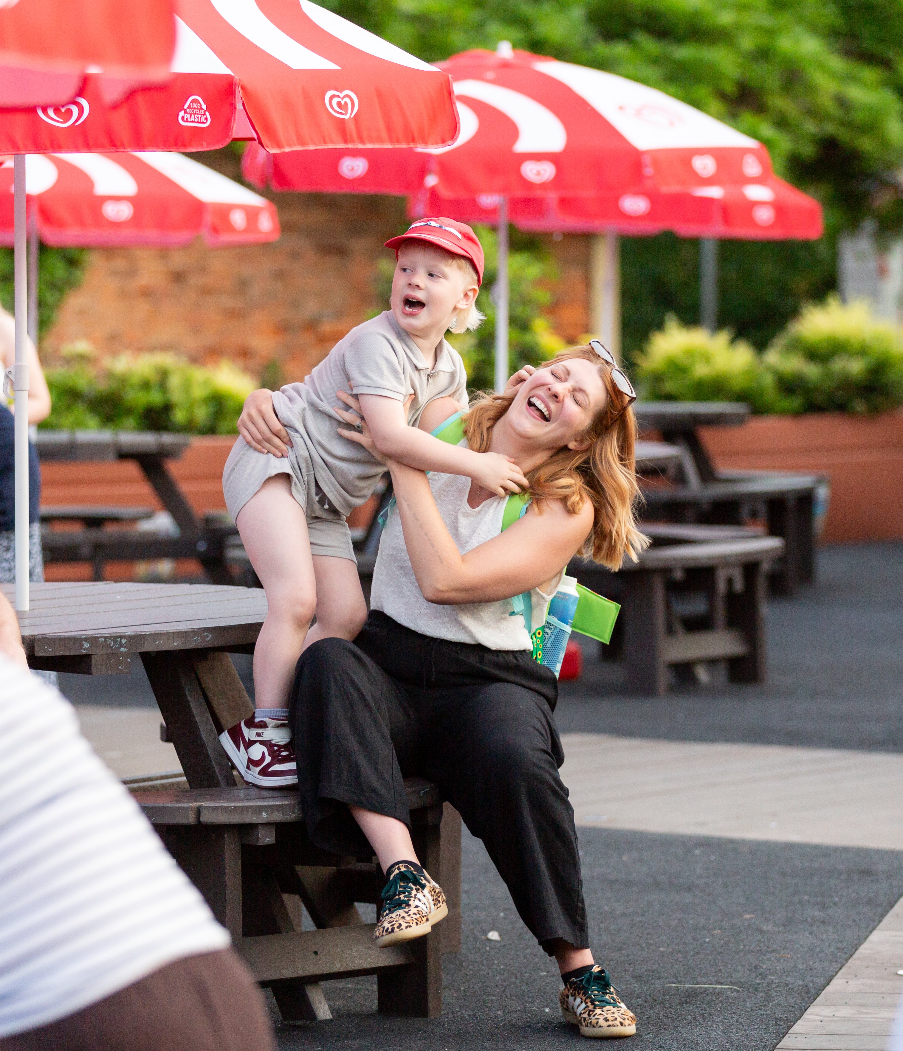 Mother and child laughing together at a SEND Fest event