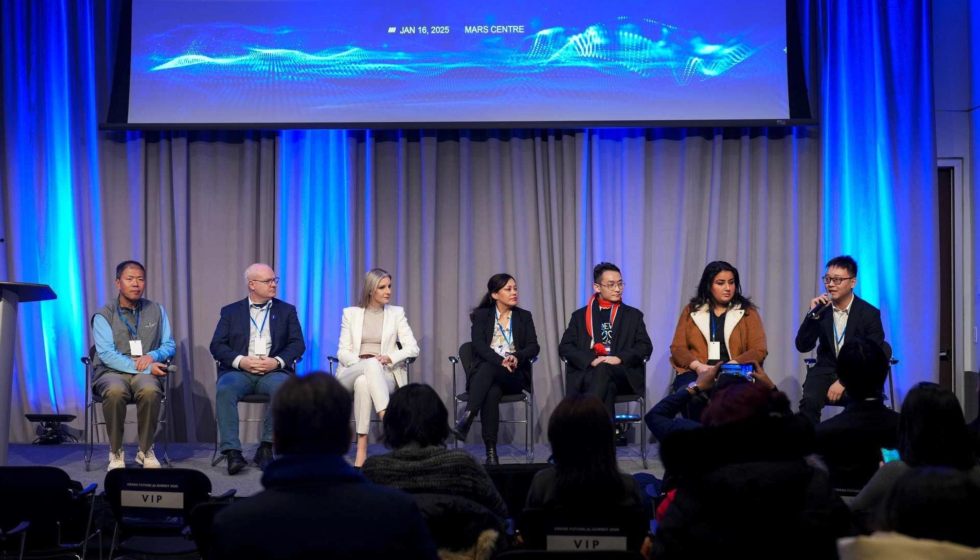 A panel of seven speakers on stage at the Cross Future AI Summit 2025.