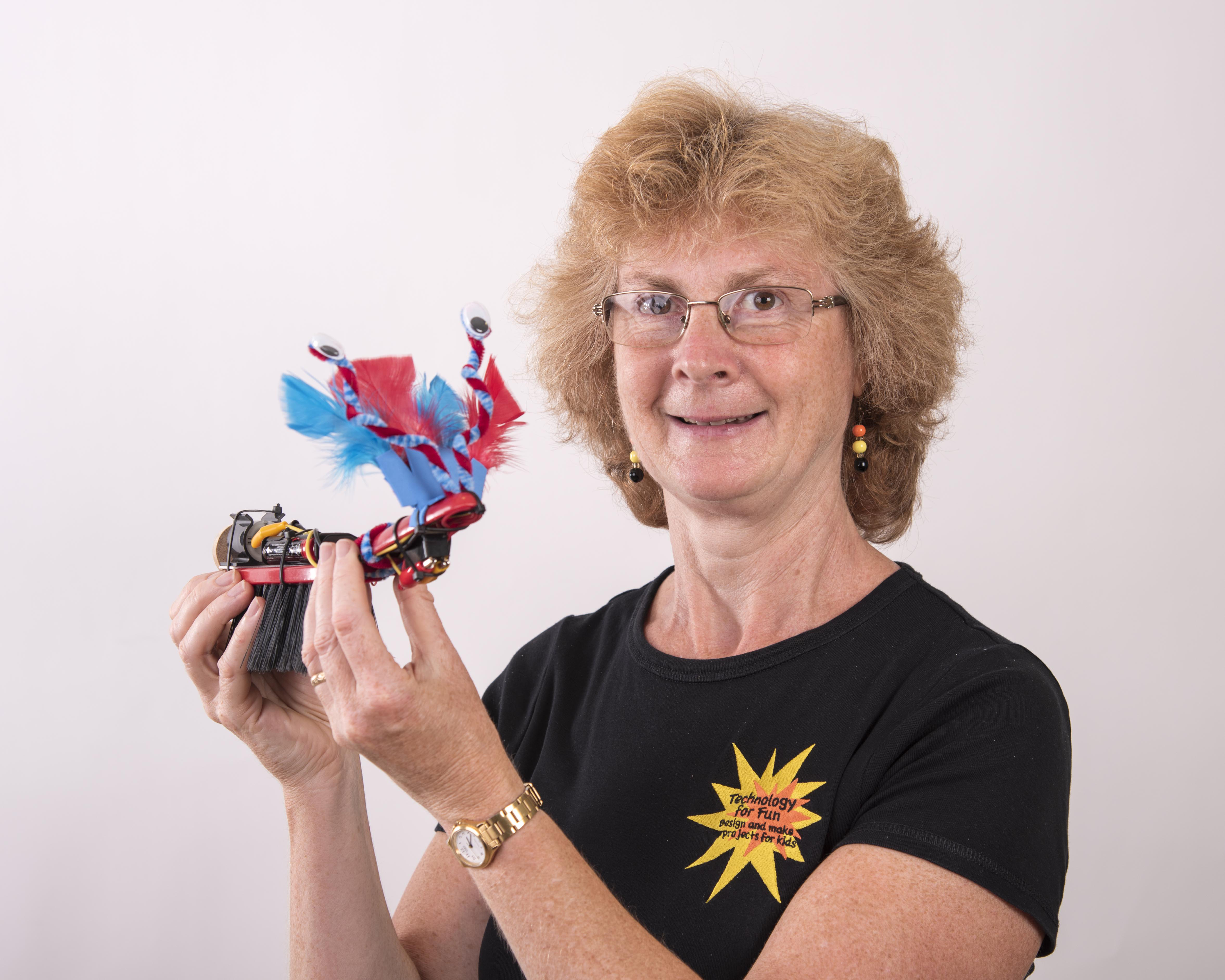 Caroline Alliston, founder of Technology For Fun, holding one of her creative technology projects