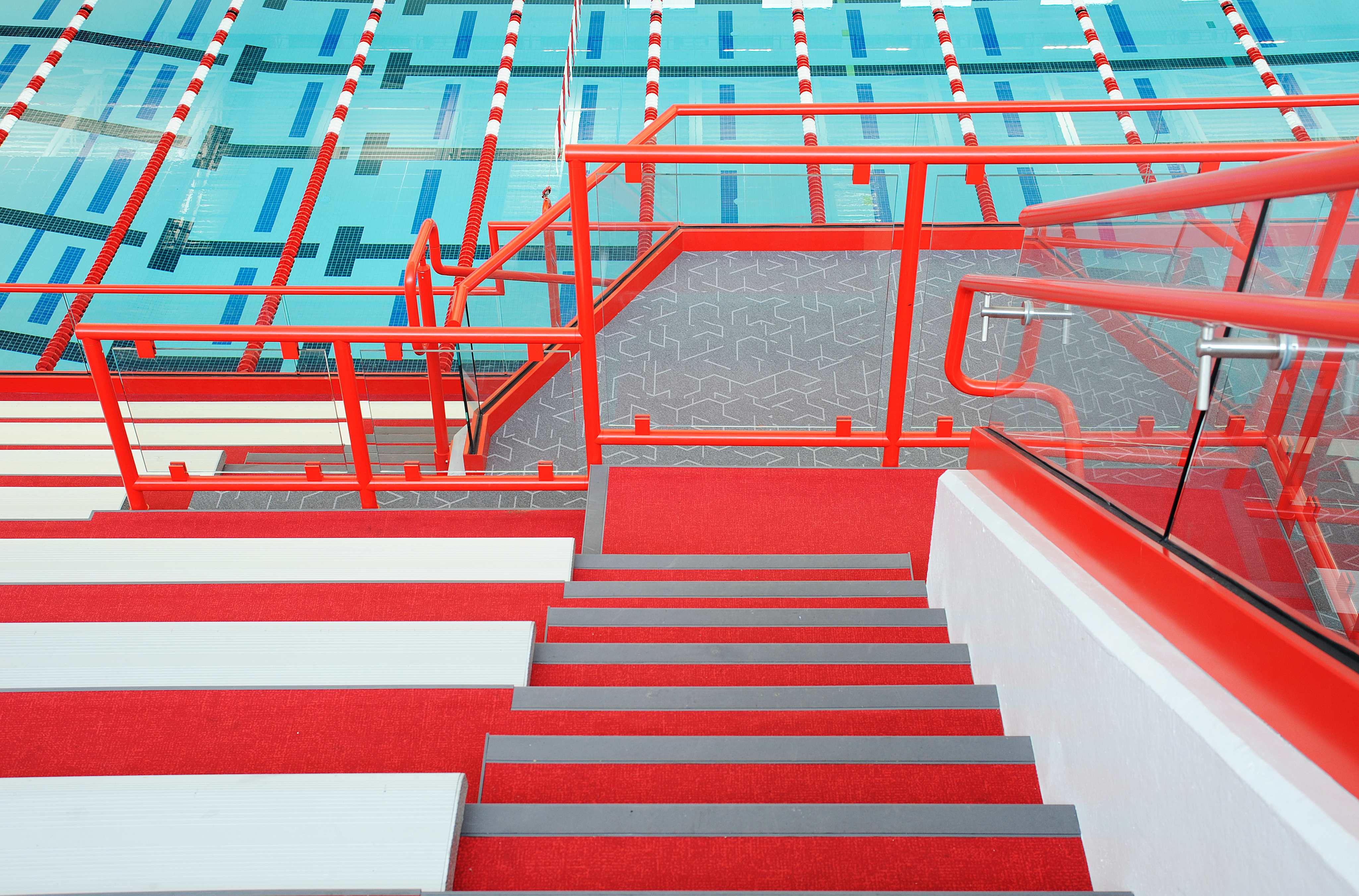 Center Grove HS Natatorium — Structural Glass at Bleacher Mid-Level Landing