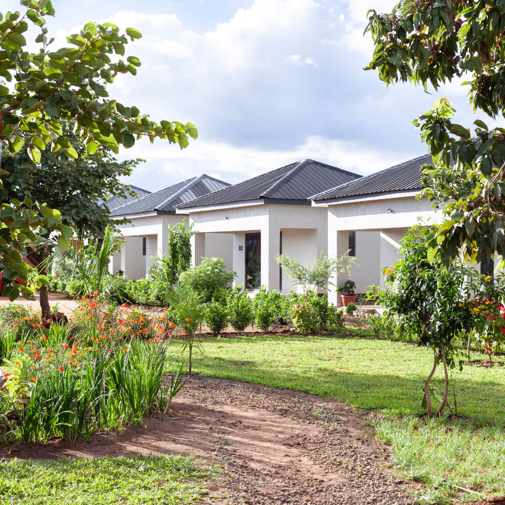 Chalo Villas estate with white modern villas and lush gardens
