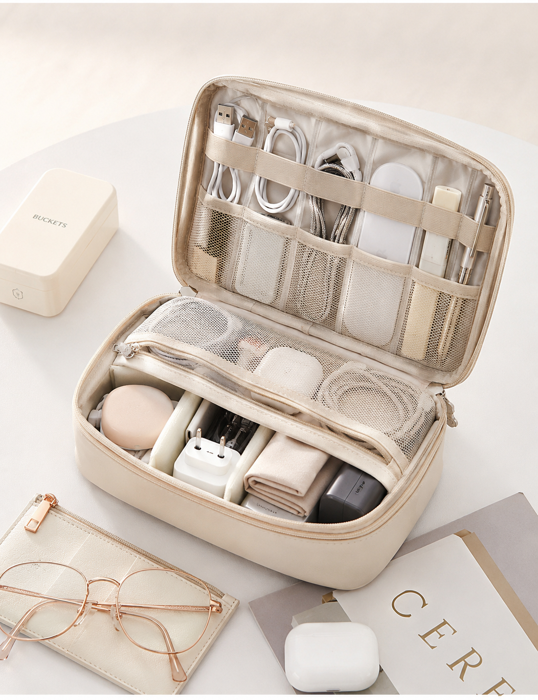 RIVOLLE organiser on stylish desk with glasses, AirPods, and magazine - sophisticated lifestyle setting