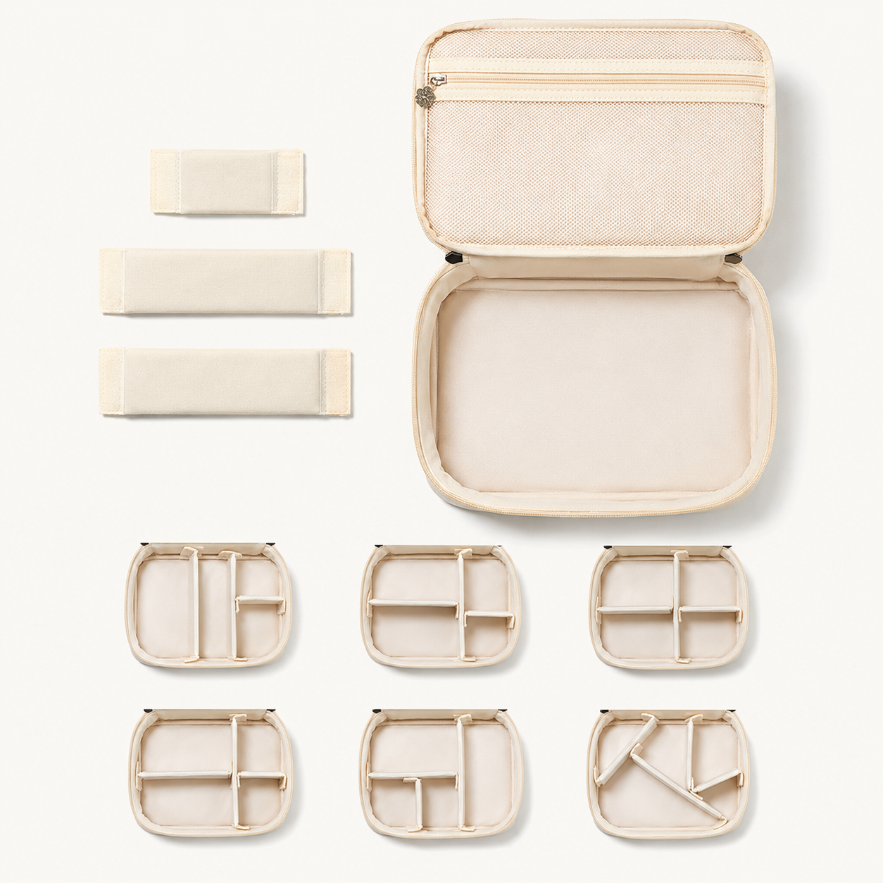Flat lay showing RIVOLLE bag open with all removable dividers and organisers laid out separately