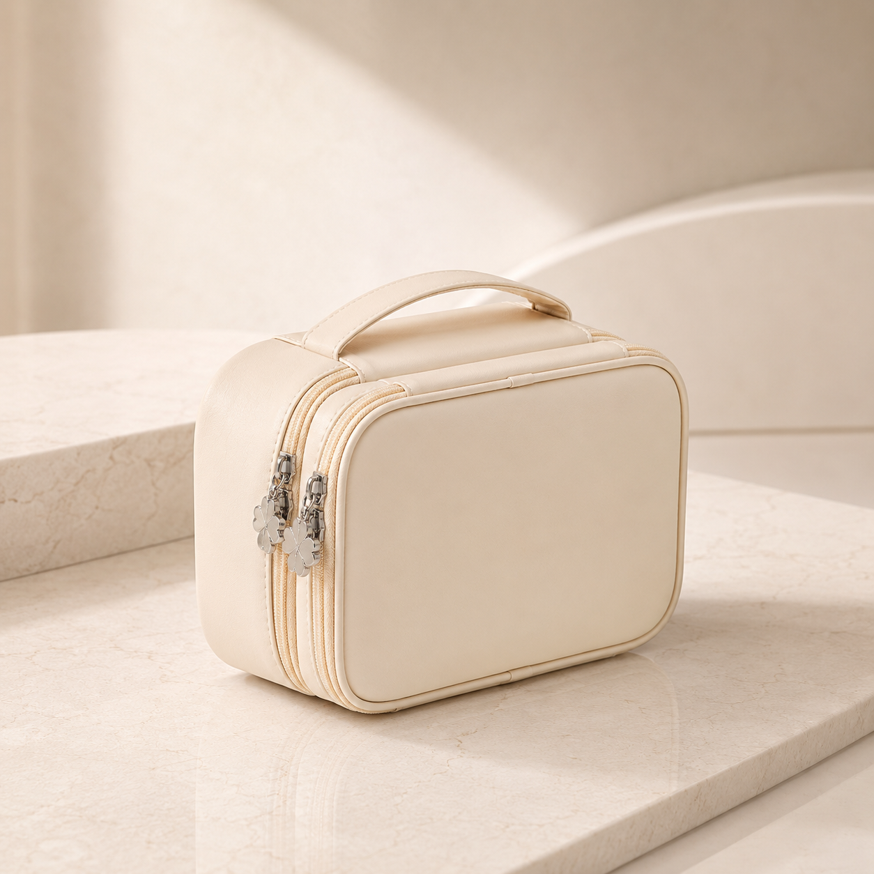 RIVOLLE organiser bag closed view showing elegant cream exterior with silver flower zipper pulls