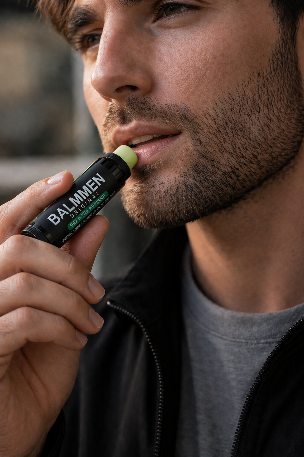Man applying BALMMEN lip balm