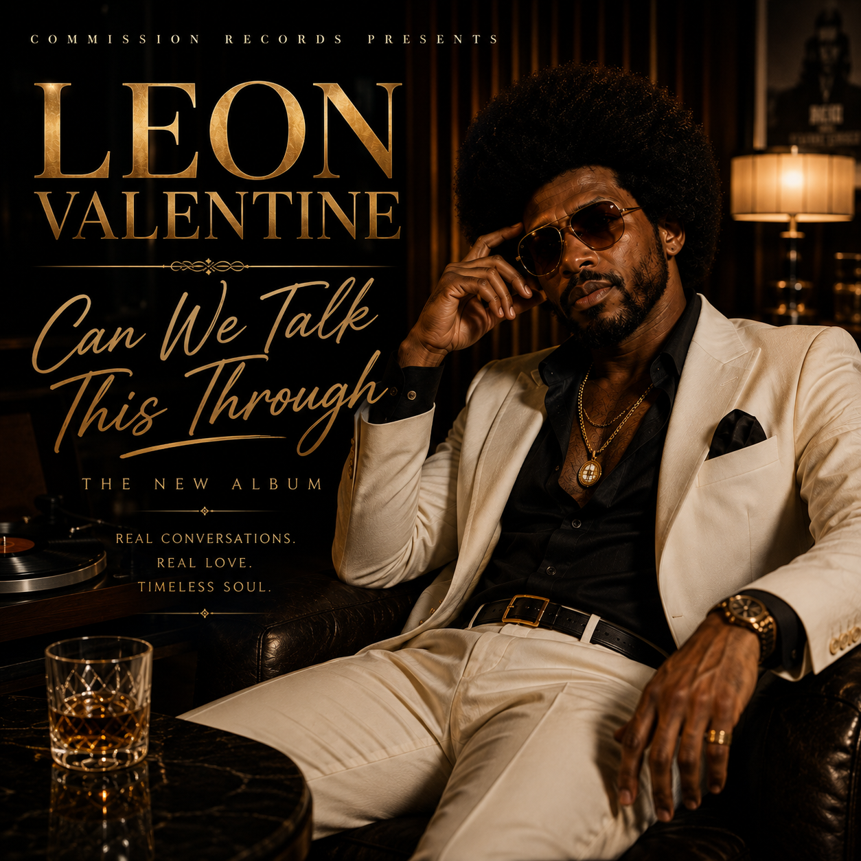 Can We Talk This Through single cover, Commission Records presents Leon Valentine, a man with an afro and aviator sunglasses in a cream suit over a black shirt with a gold medallion chain and gold watch reclining on a black leather sofa in a warm dimly lit lounge with a vinyl turntable and a glass of whiskey, with gold LEON VALENTINE lettering, Can We Talk This Through gold script, and the tagline Real Conversations Real Love Timeless Soul