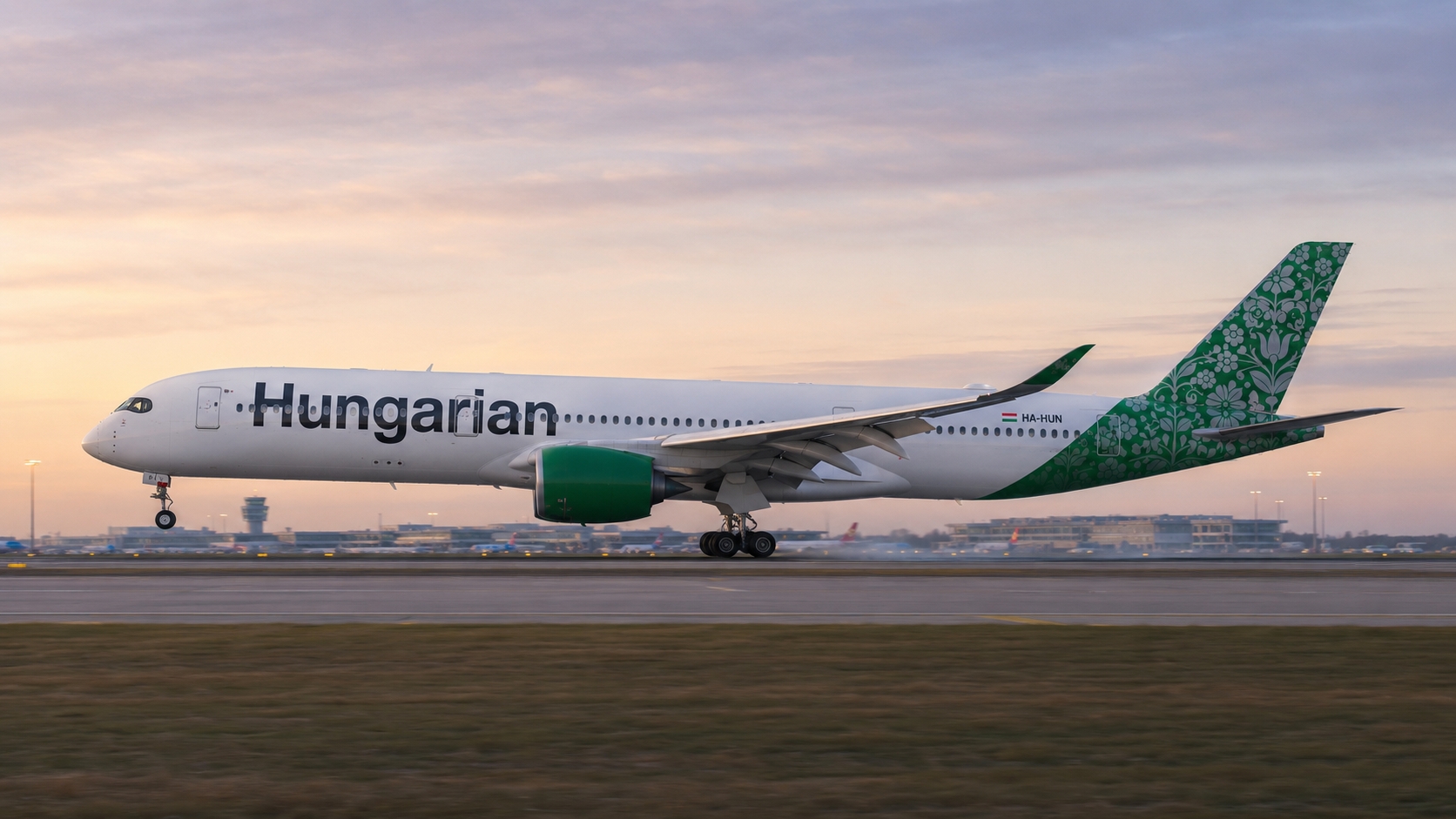 Hungarian Airlines A350 aircraft with Kalocsai folk art livery on runway at golden hour