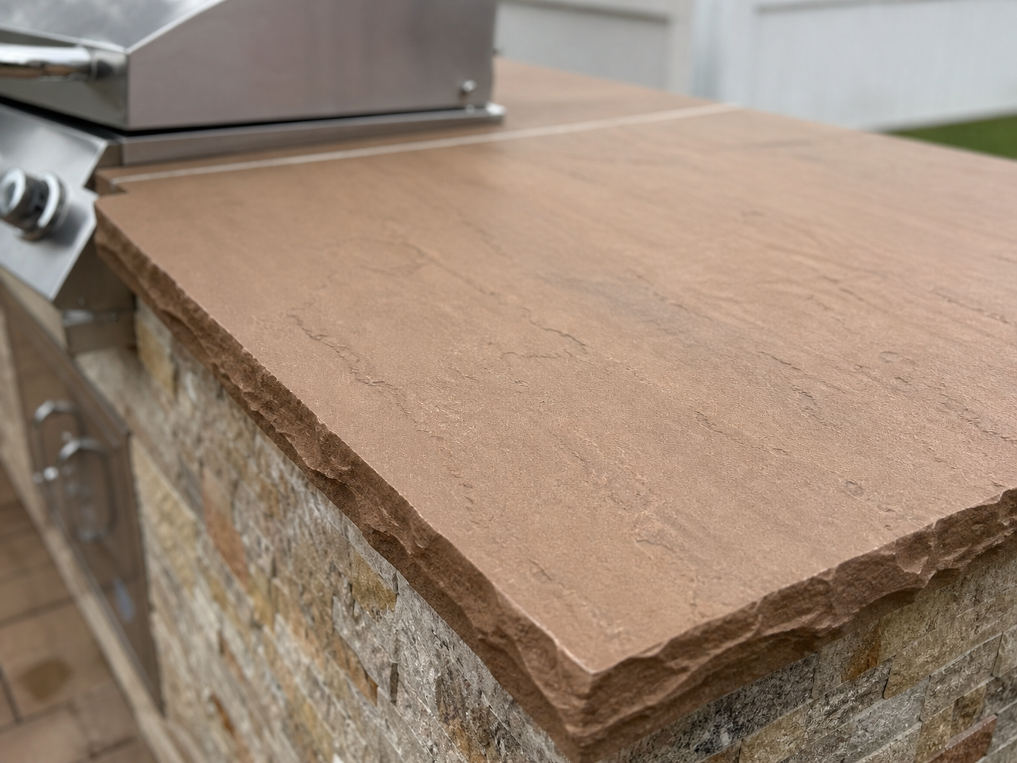 Brown stone countertop - warm terracotta natural stone slab