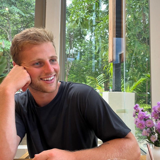 Jack Moses smiling in a naturally lit space