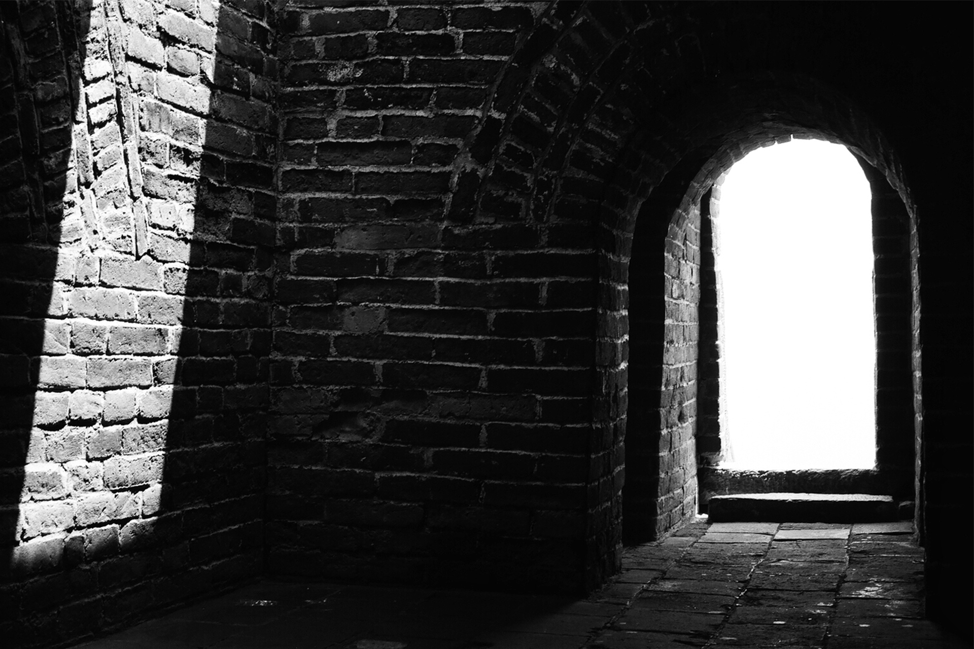 Dark brick passageway and tunnel interior through Great Wall fortification