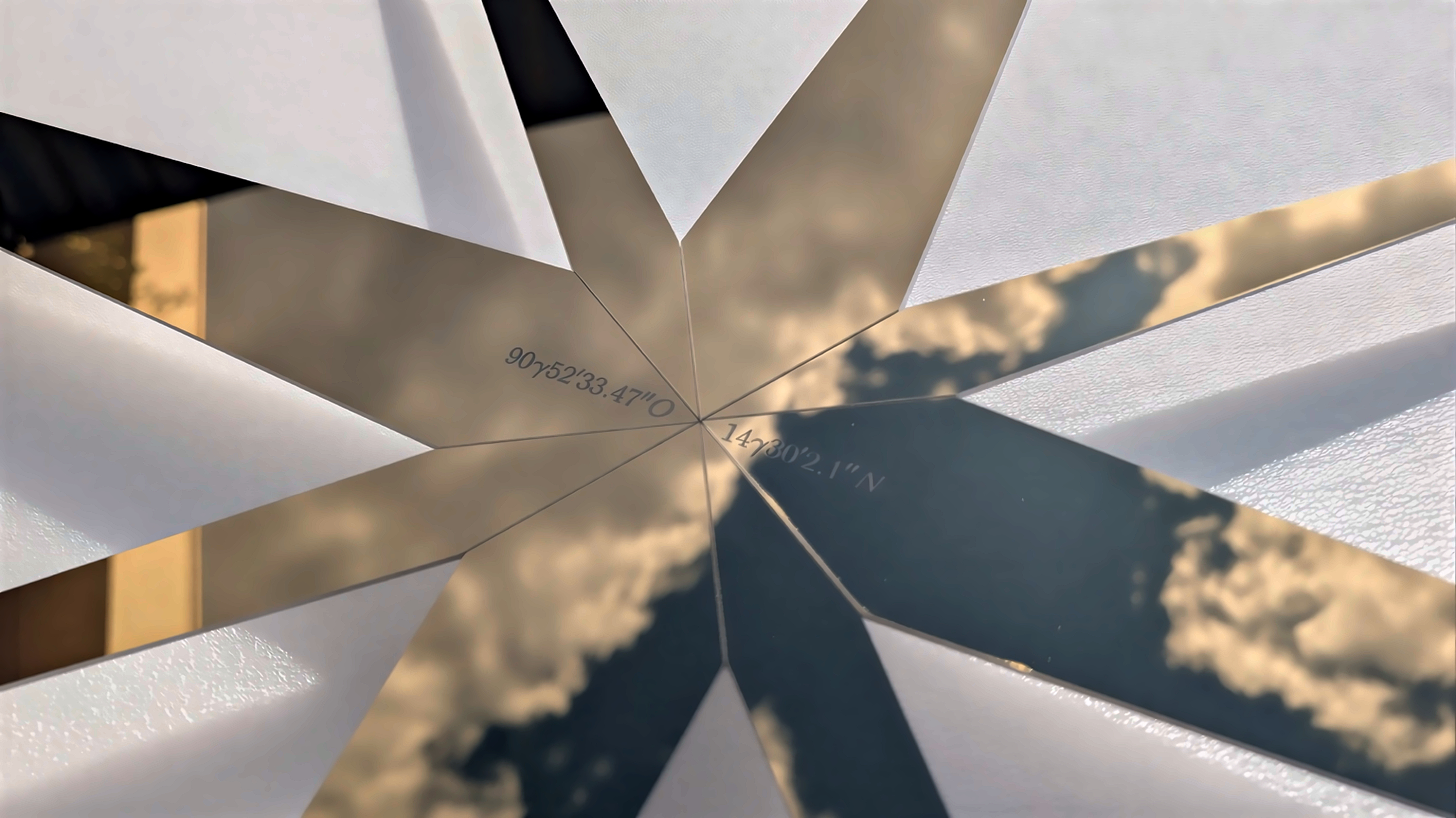 SUPERSTAR I - Close-up detail showing reflective surface with GPS coordinates