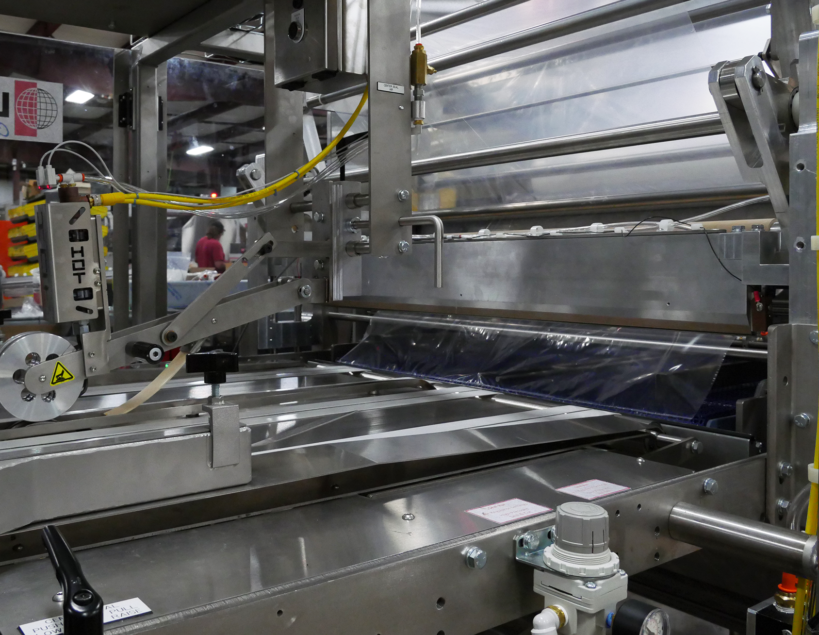 Cross SeaLeMatic seal bar mechanism on a commercial bakery packaging line