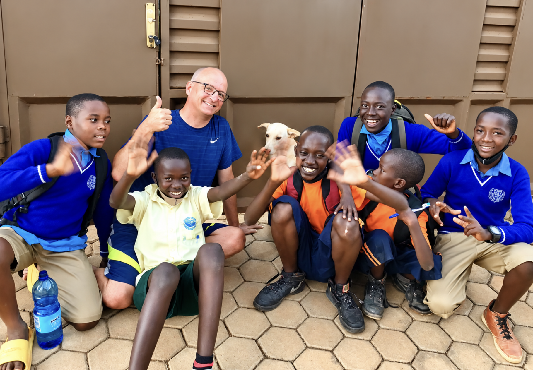 Jerry Cooper with the boys in their school uniforms after receiving support