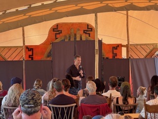 Speaker in tent venue