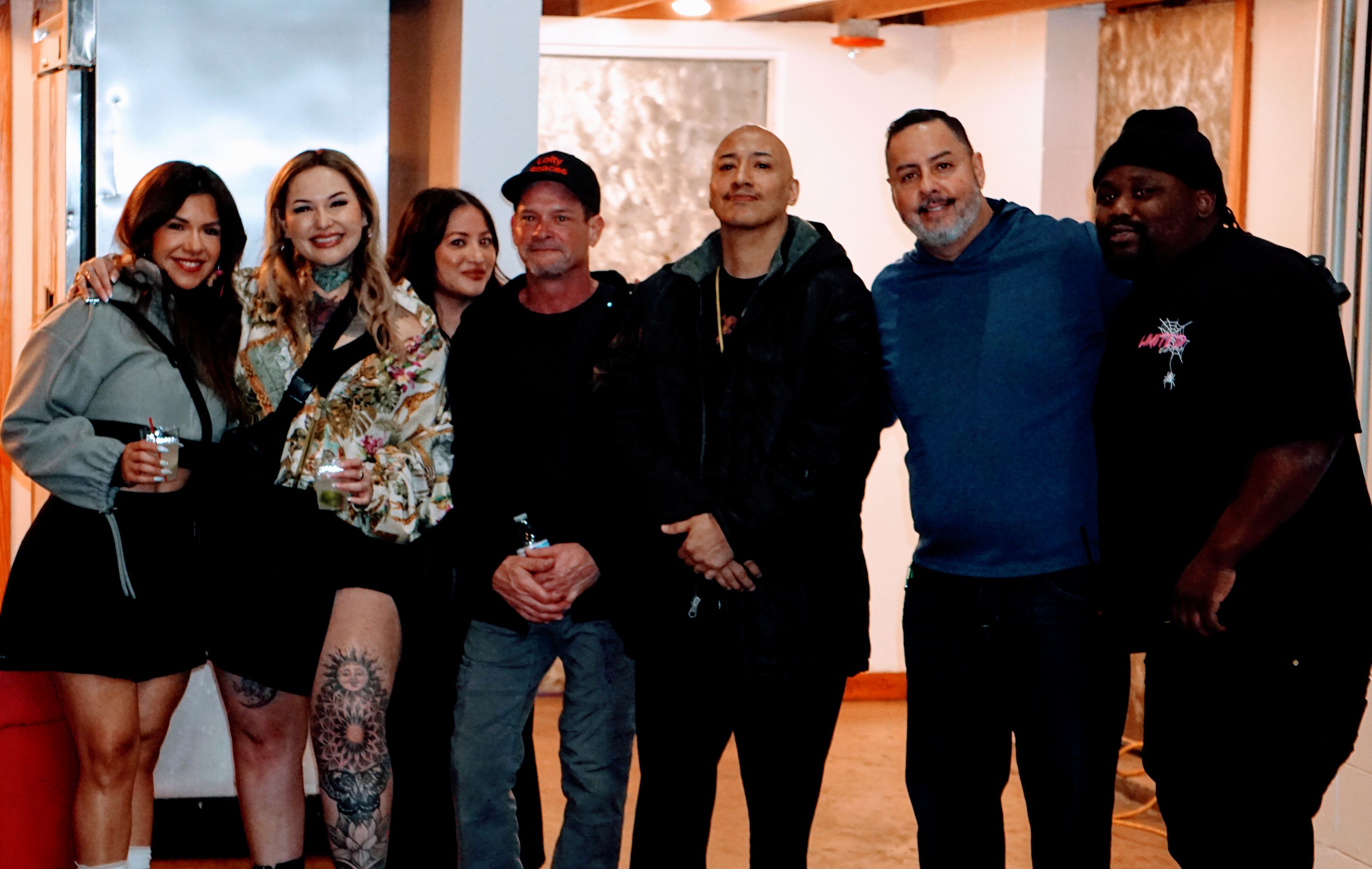 Group photo of artists and organizers at the event