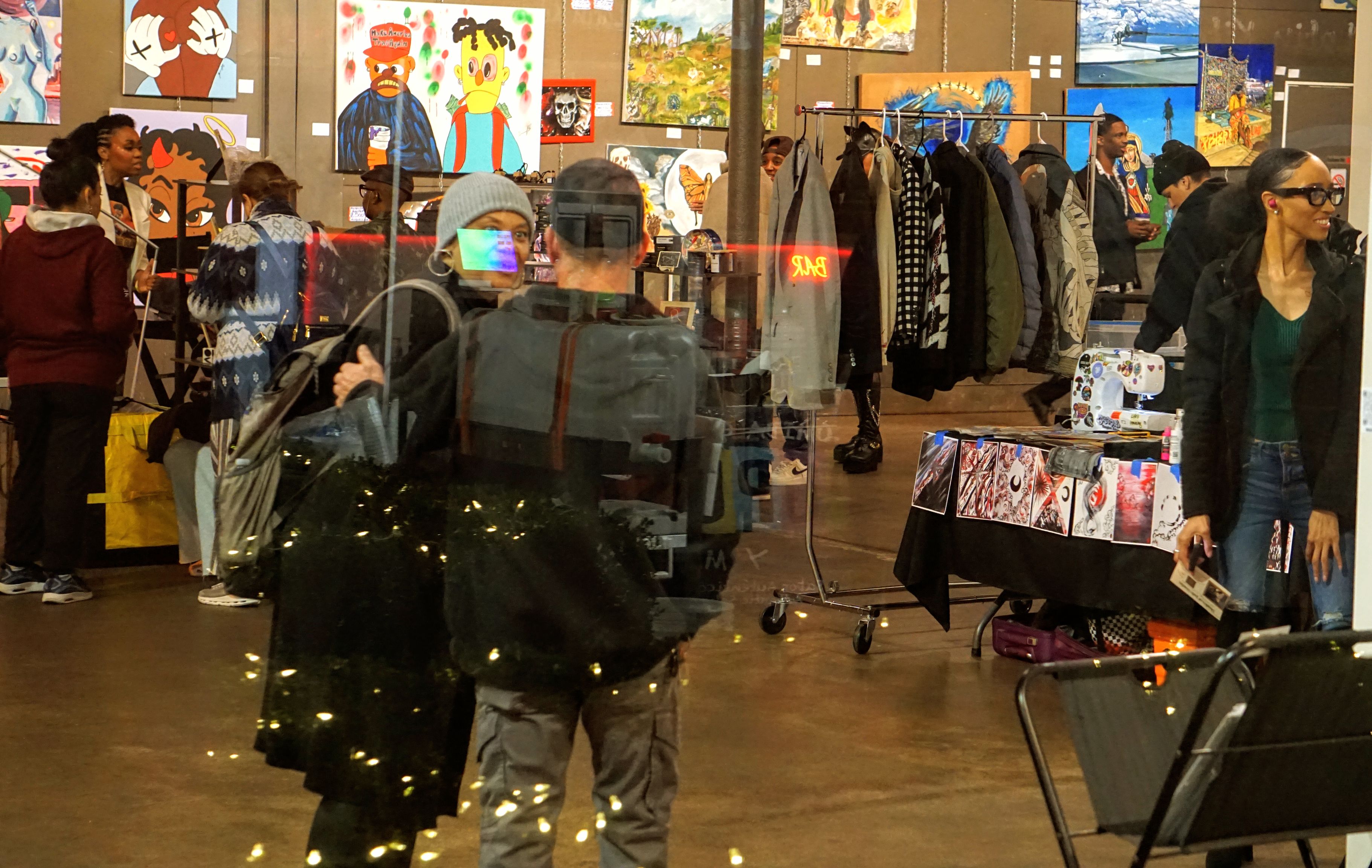 Crowd enjoying art show with vendors and artwork