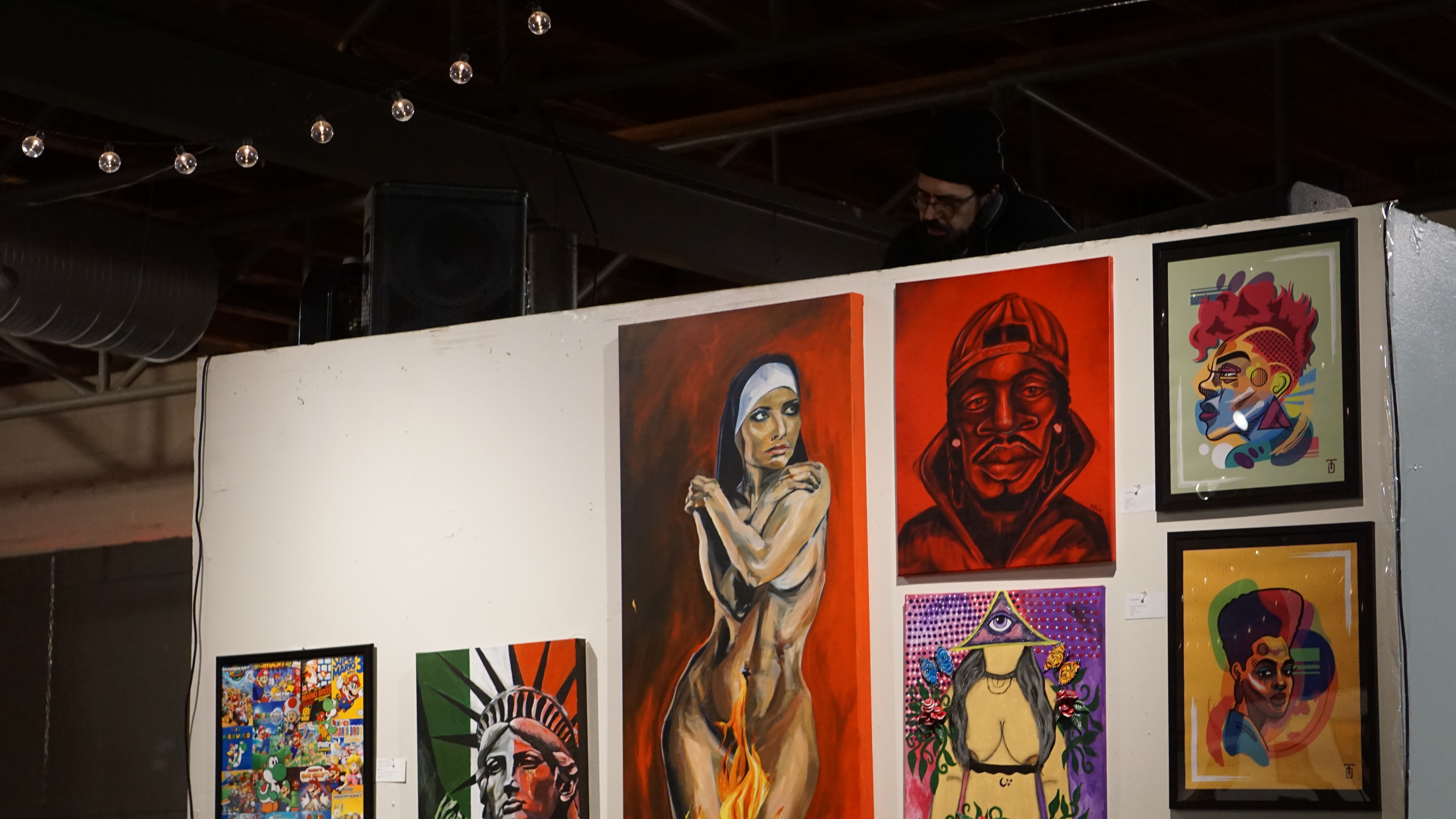 Art gallery wall with paintings and portraits