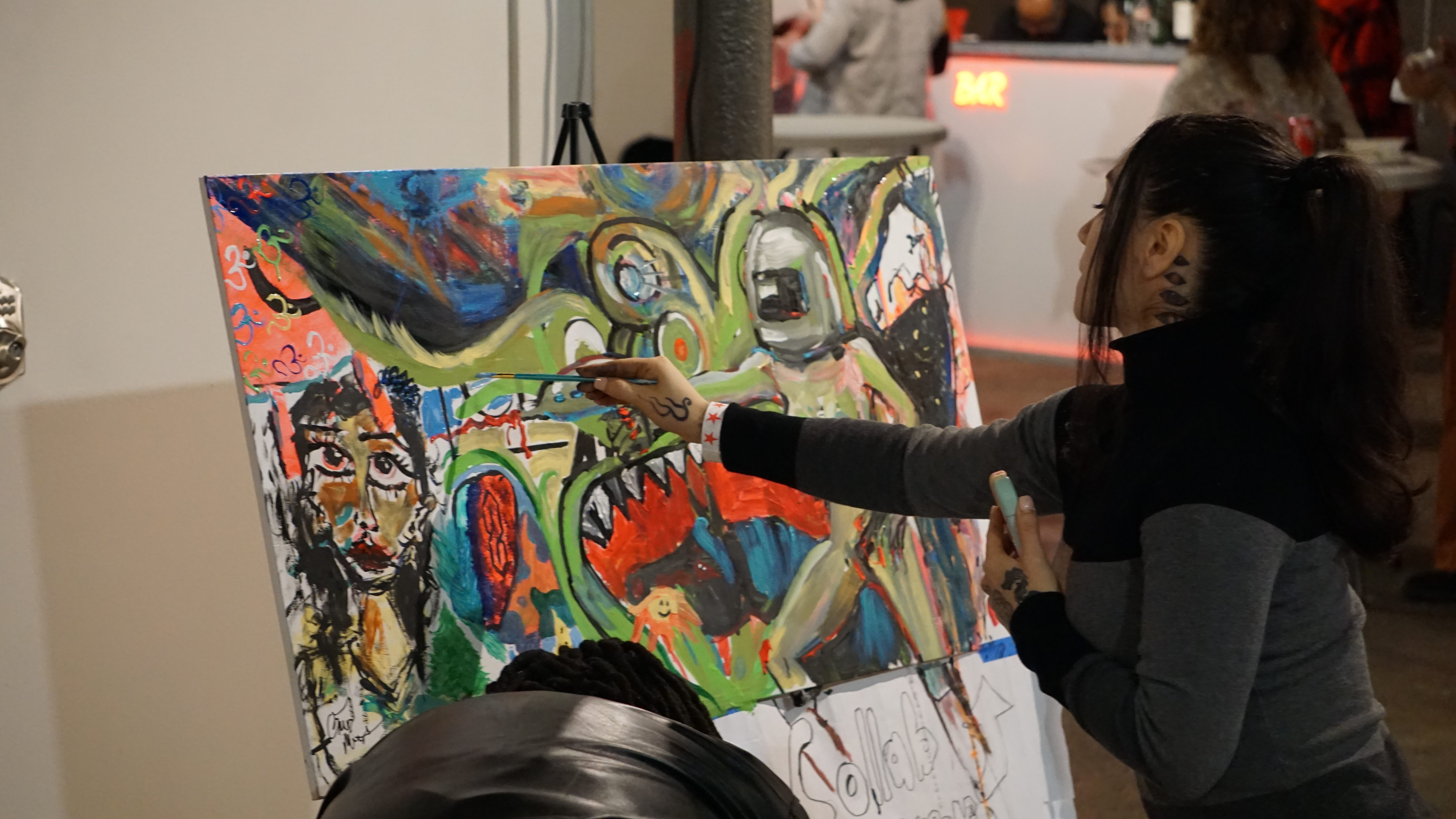 Artist live painting colorful abstract artwork