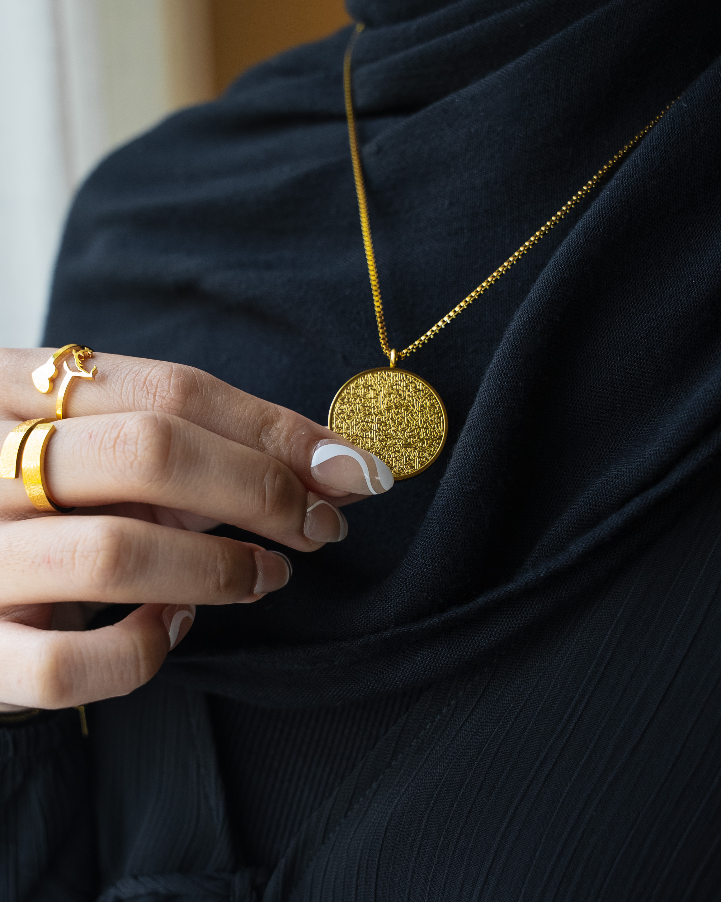 Gold pendant jewelry product photography