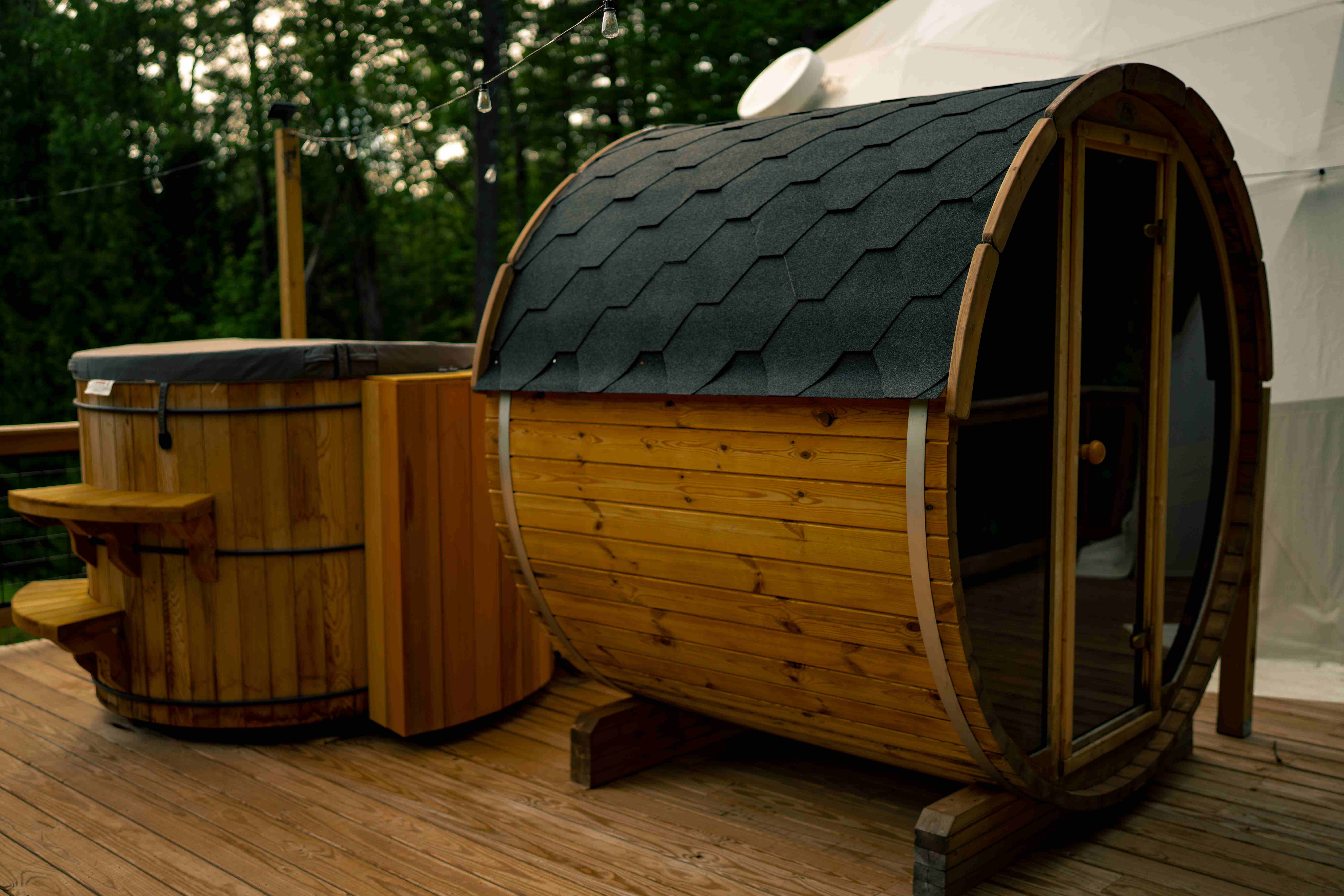 Cedar barrel sauna and wooden hot tub on the deck